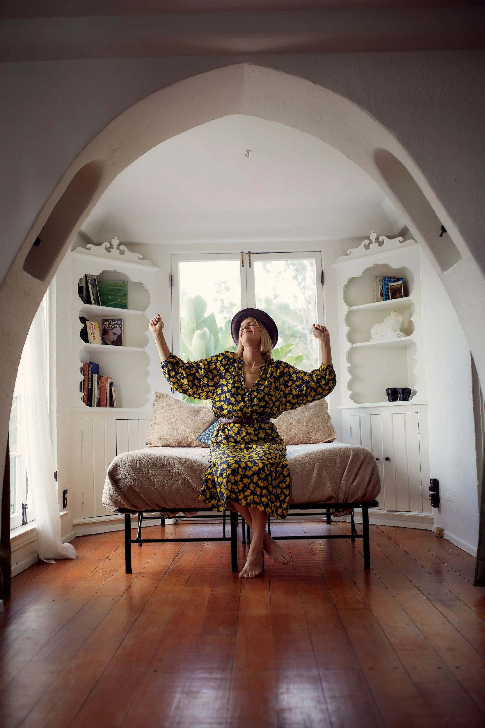 Woman dancing in bed after recovering from panic attacks in Reston, VA