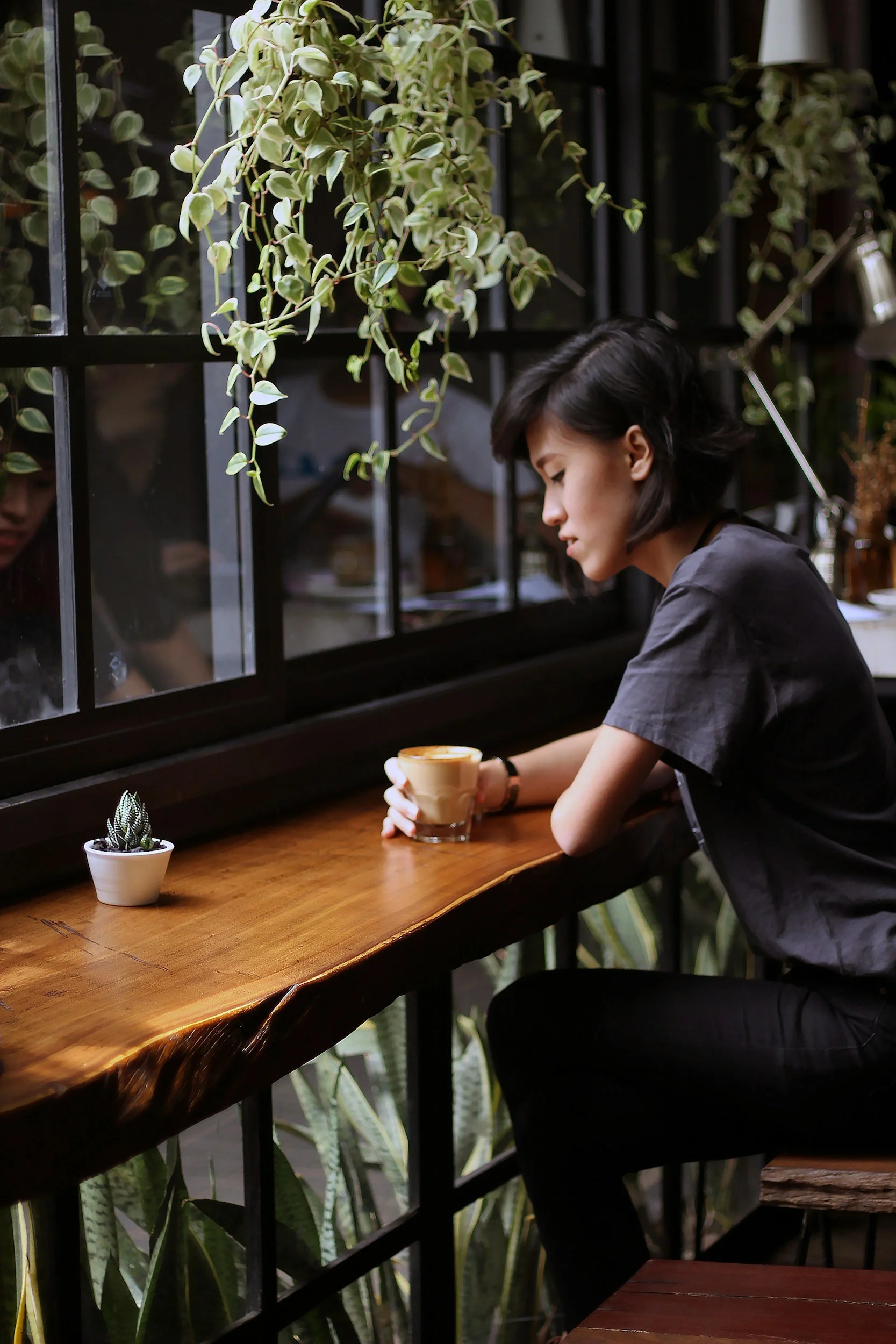 Woman drinking coffee after therapy for panic attacks in Reston, VA