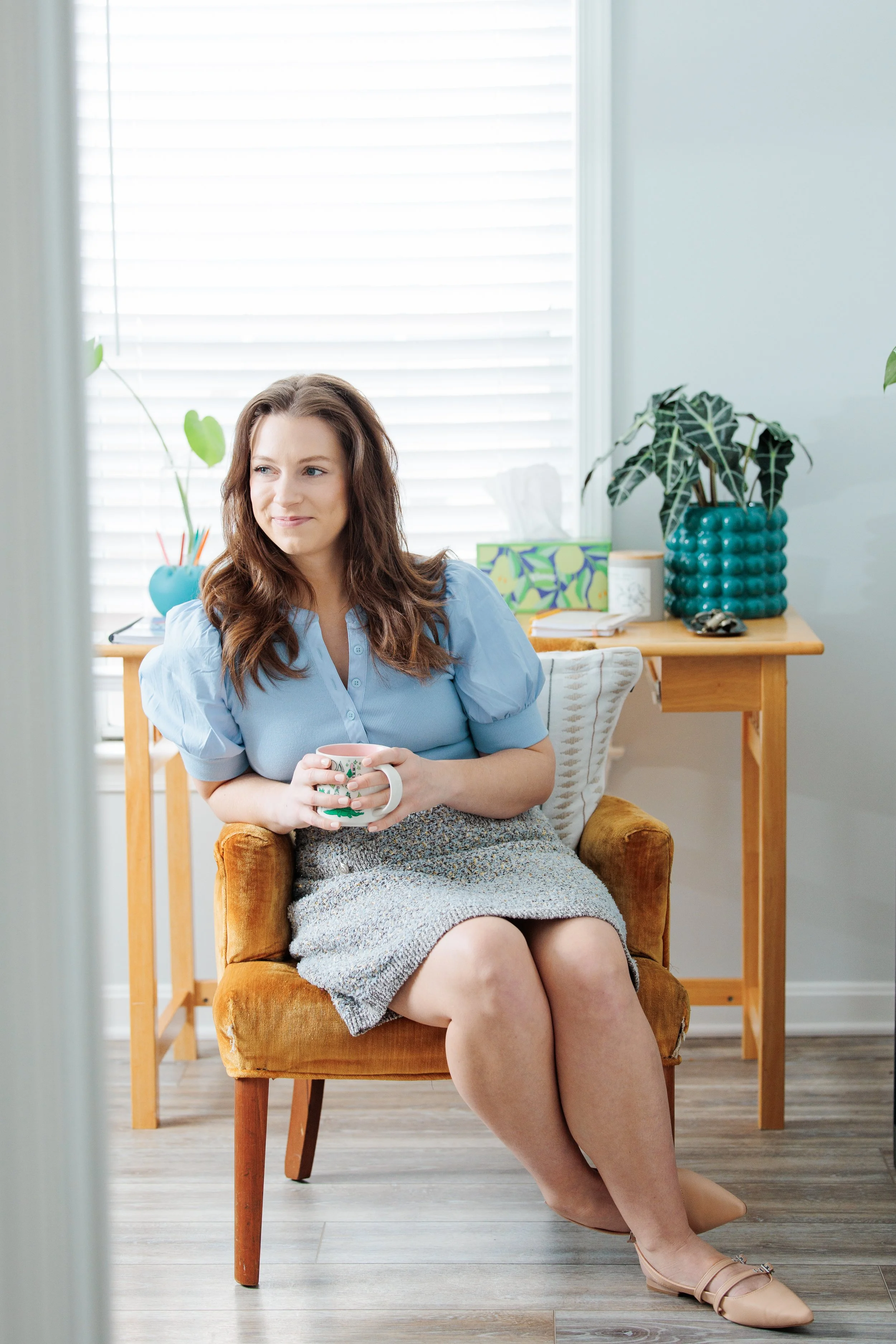 Therapist smiling in office treating panic attacks in Reston, VA