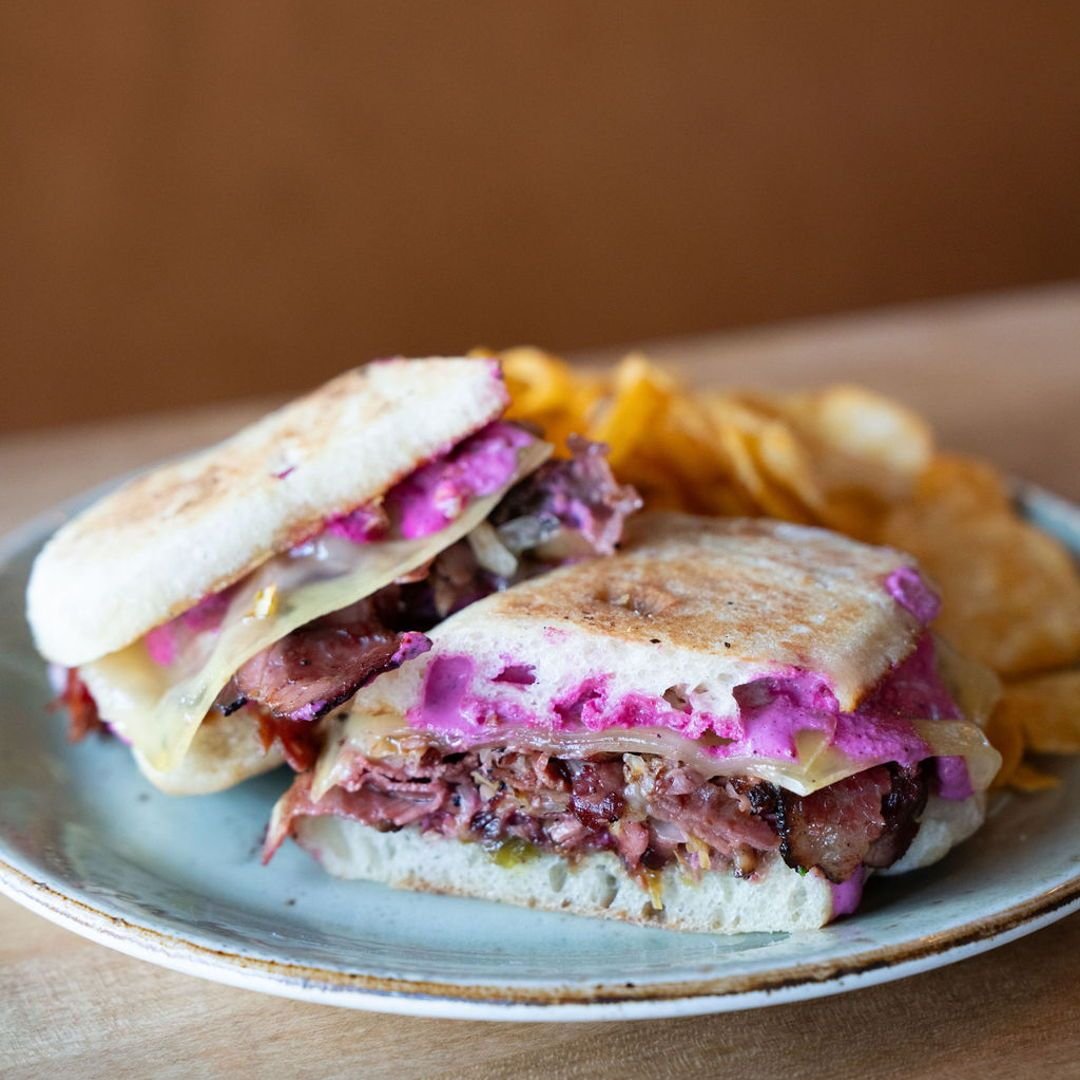 What's your favorite sandwich on our lunch menu? If you ask our staff members, most of them will say this guy - pastrami with sauerkraut, candied jalape&ntilde;o, gruyere, and house Ukranian dressing 🤤