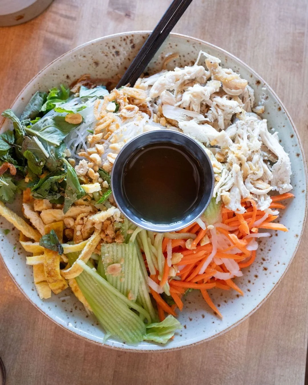 Our most-loved dish for a reason. Fresh lettuce, glass noodles, pickled veggies, cucumber, egg, peanuts, crispy shallots, and our herb trio come together in this vibrant Vietnamese noodle salad 🥢🌿