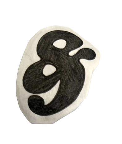 A black ampersand printed on paper