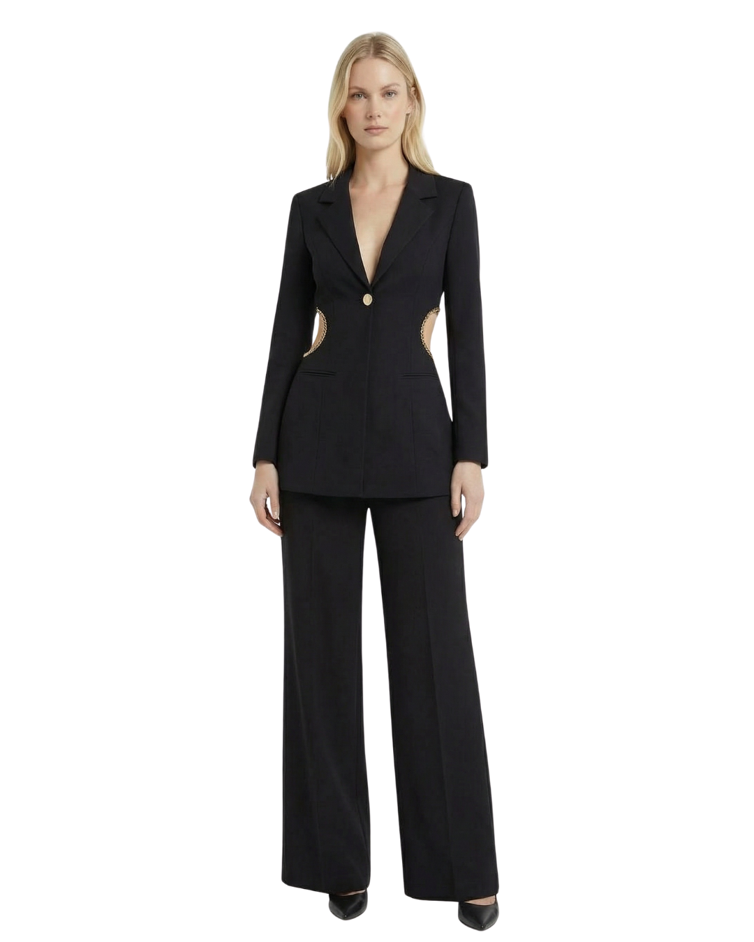 A woman wearing a black blazer with gold accents on the sides, paired with matching black wide-leg trousers.