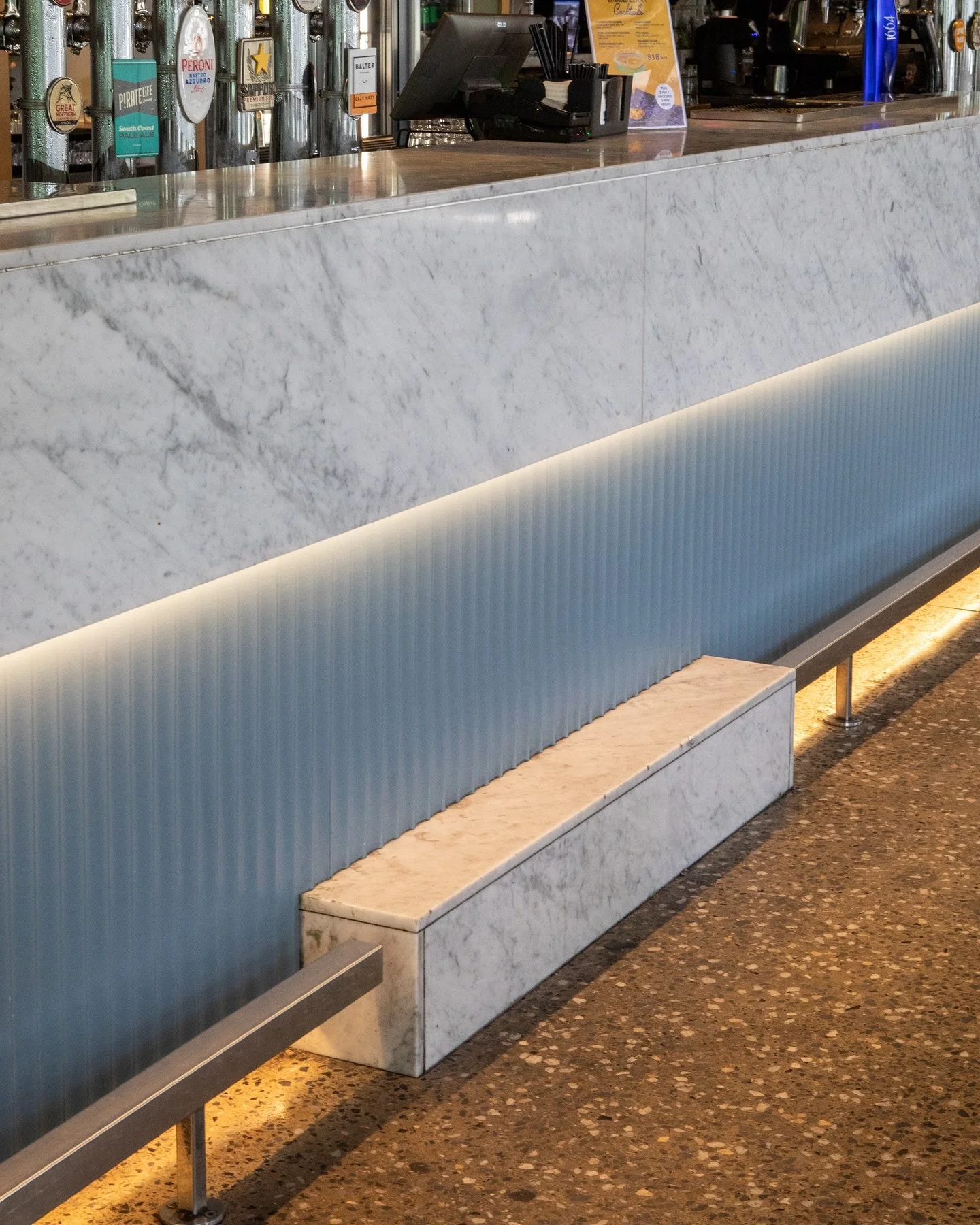 @surround.bylaminex making a huge impact on the @walkersarms hotel bar front.

Finished with @duluxaus Five Fingers Pensinsula, giving the marble a whole different look! 

@daniellegrace.photography 
#adelaide #adelaideinteriors #hotelsofadelaide #in