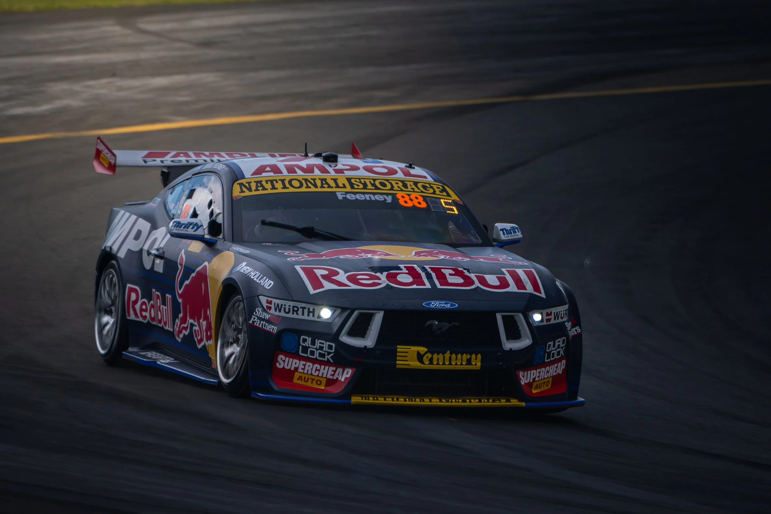 Race car with Red Bull branding on a race track.