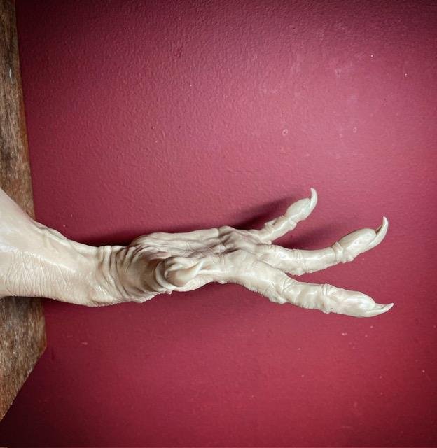 creepy hand sculpture