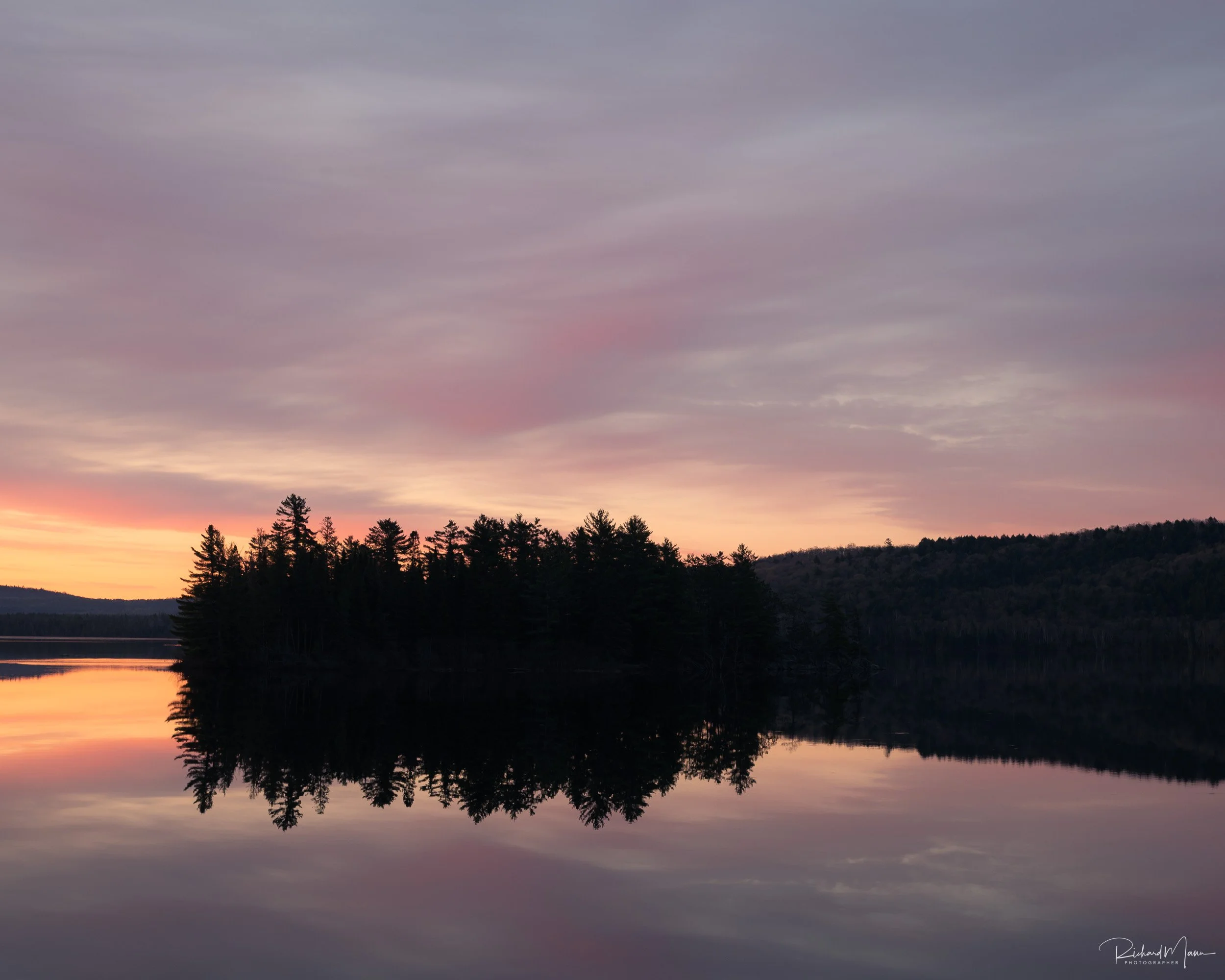 Soft light on the clouds with the island of Lake of Two Rivers in Algonquin Park