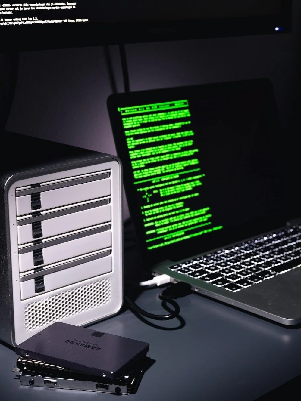 Digital forensics setup showcasing tools for hard drive analysis and cyber intrusion investigation by Automated Systems