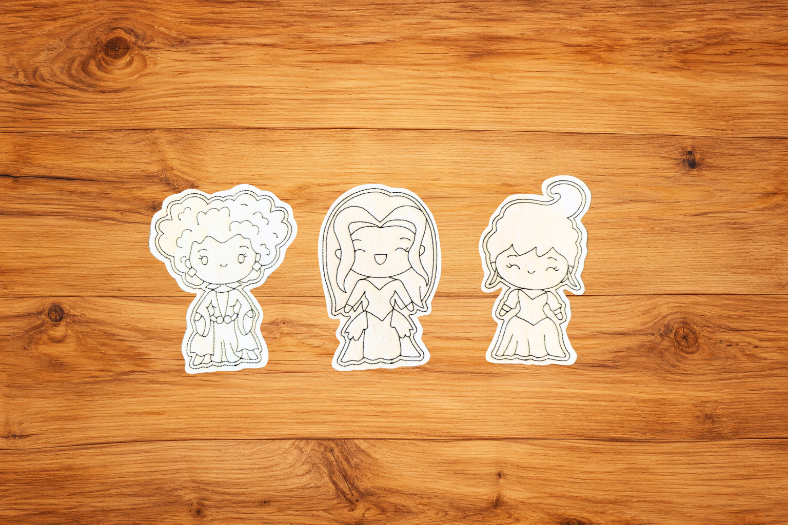 Witchy Woman - set of 3.pngThree handmade Witchy Women reusable Halloween Coloring Cuties displayed together on a warm wood background