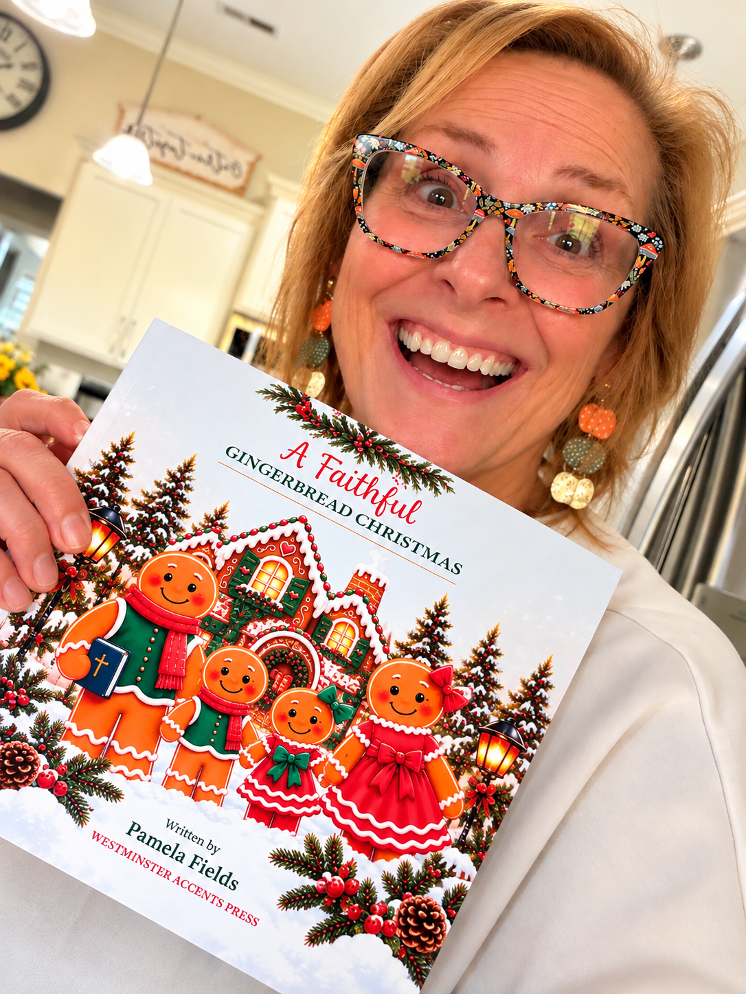 Author Pamela Fields smiling while holding her children's Christmas picture book, A Faithful Gingerbread Christmas, published by Westminster Accents Press.