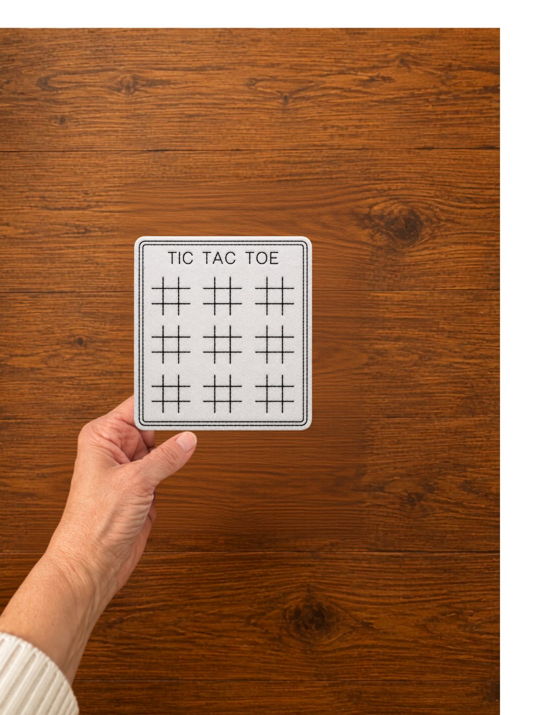 hand with tic tac toe.png