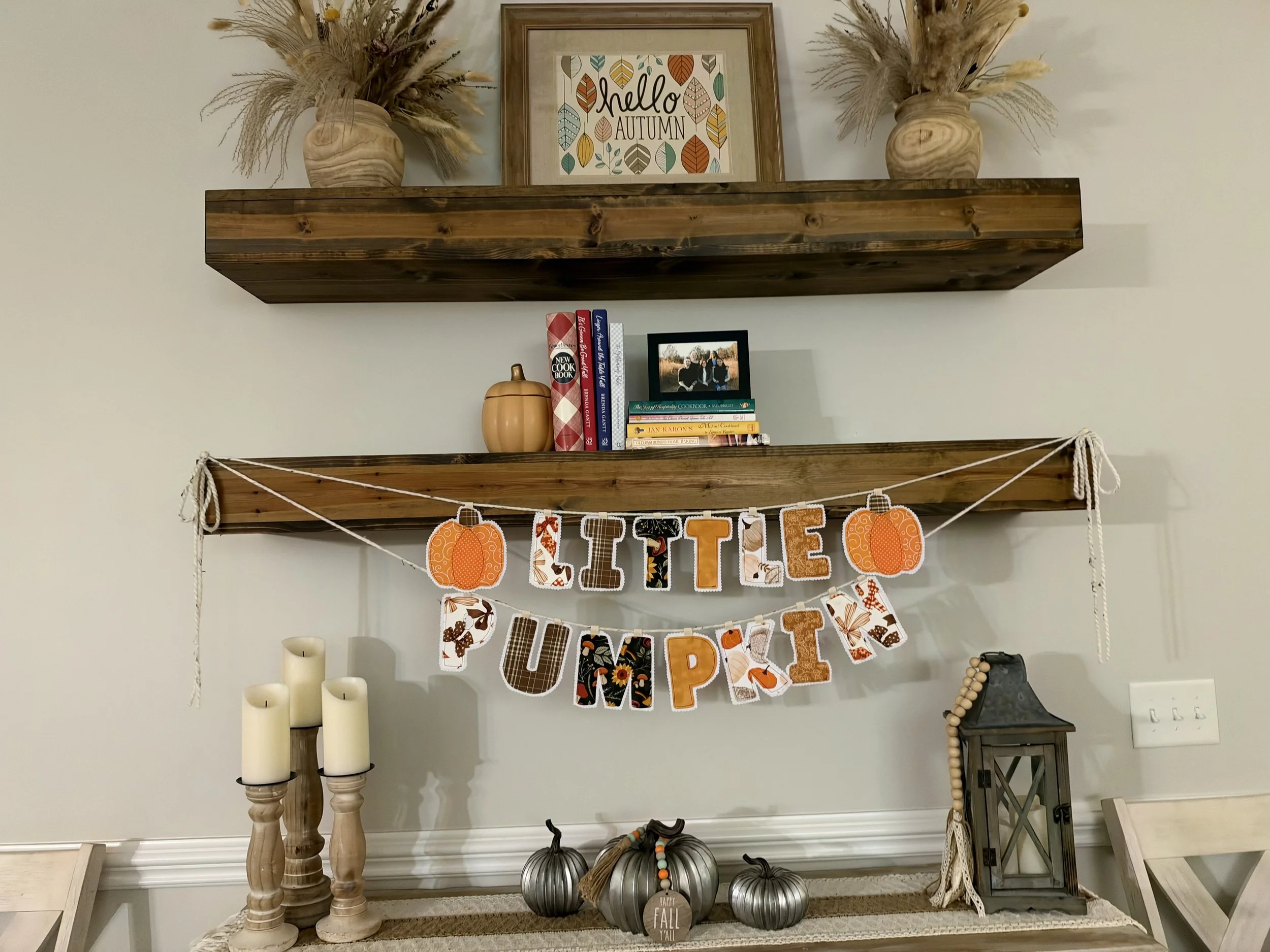 Handmade Little Pumpkin fabric letter banner with coordinating autumn prints and pumpkin accents for a fall baby shower.