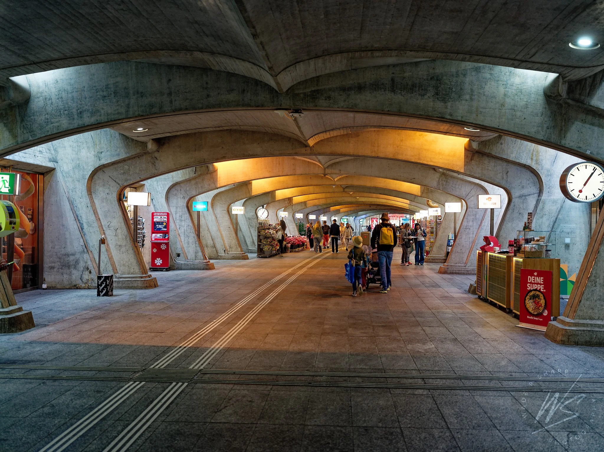 The underground shopping passage at Zürich Hauptbahnhof (Zurich Central Station), Zurich, Switzerland. The distinctive organic concrete vaulted ceiling was designed by Santiago Calatrava as part of his 1990 expansion of the station — one of the most 