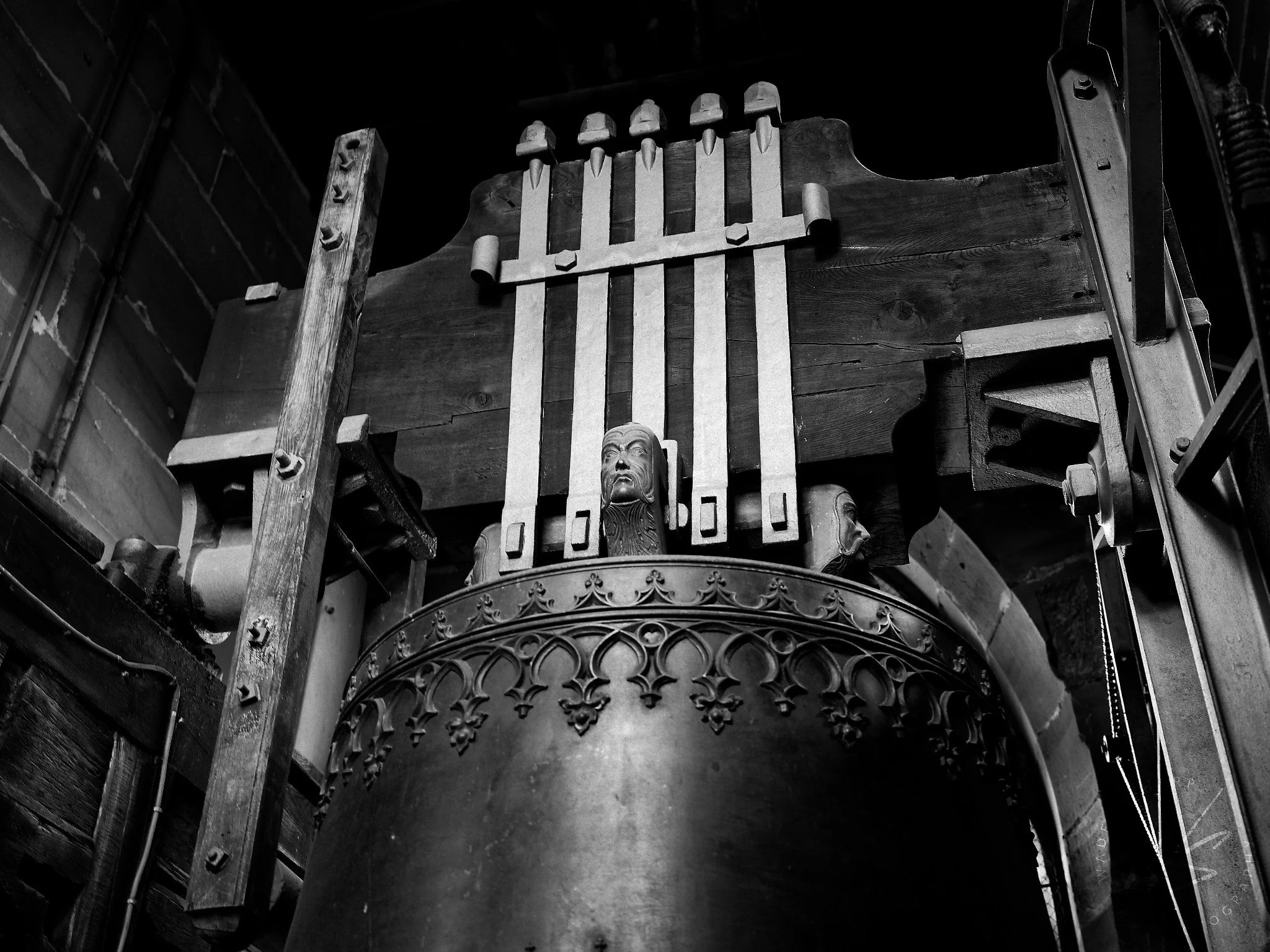 A bell in the tower of the Basler Münster (Basel Cathedral), Basel, Switzerland. Built between 1019 and 1500 in Romanesque and Gothic styles, the Münster is Basel's most iconic landmark. The cathedral's most historically notable bell is the Pabstgloc