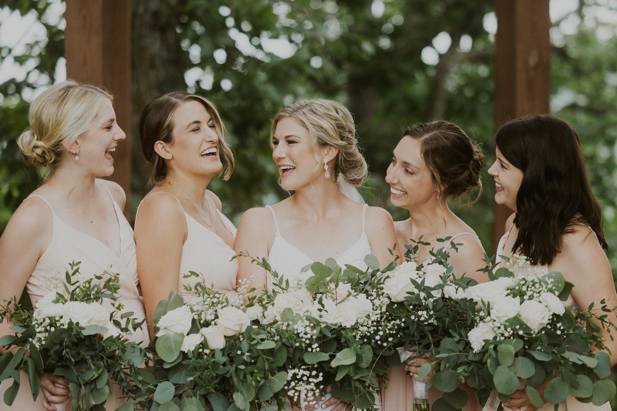 bride and bridesamids smiling.jpg