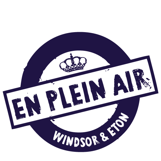 A circular logo with the text "EN PLEIN AIR" across the center and "WINDSOR & ETON" at the bottom. A crown symbol is at the top of the circle.