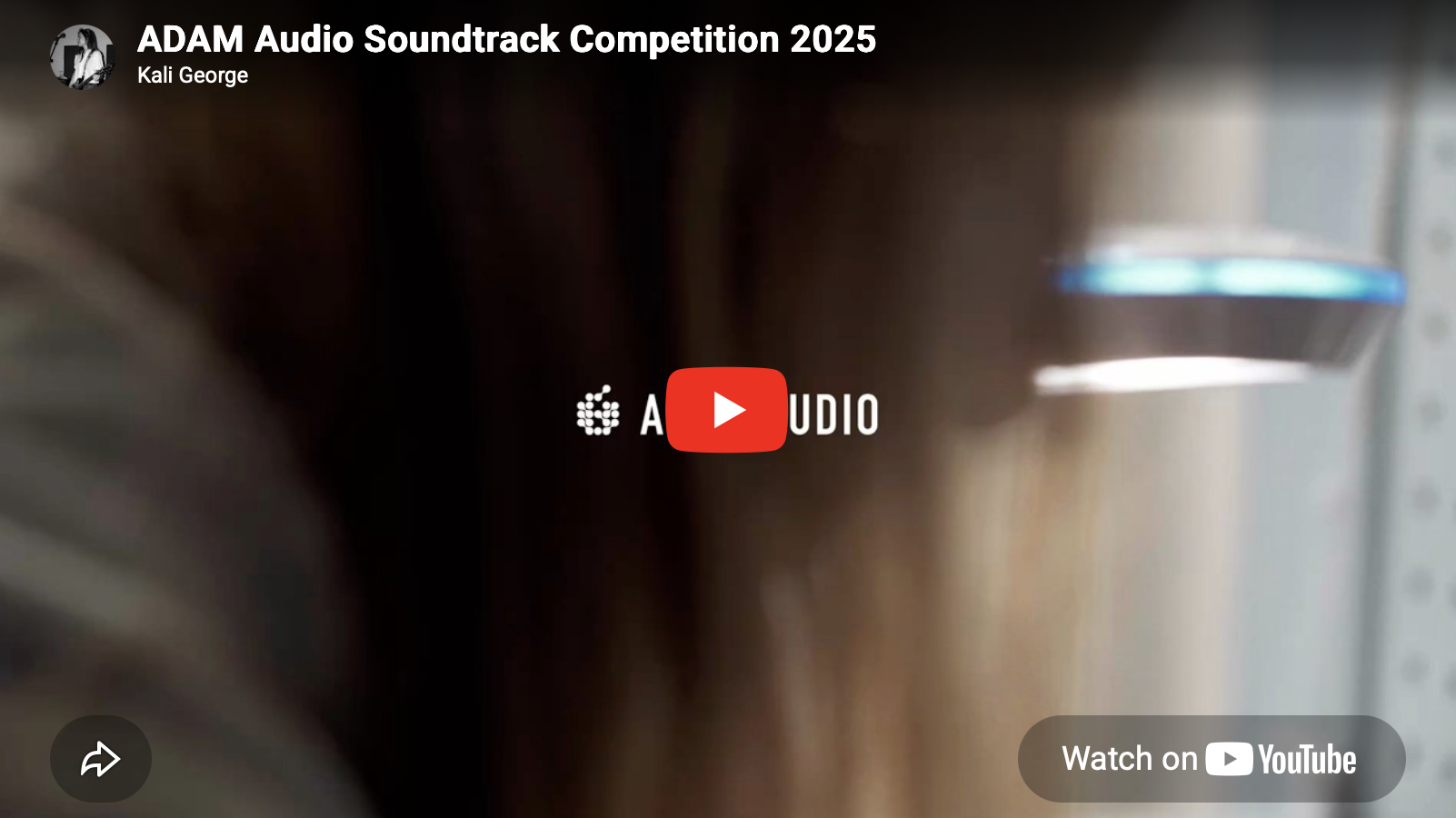 Video thumbnail for ADAM Audio Soundtrack Competition 2025 featuring Kali George, showing a blurred image of electronic equipment with a black and blue knob.