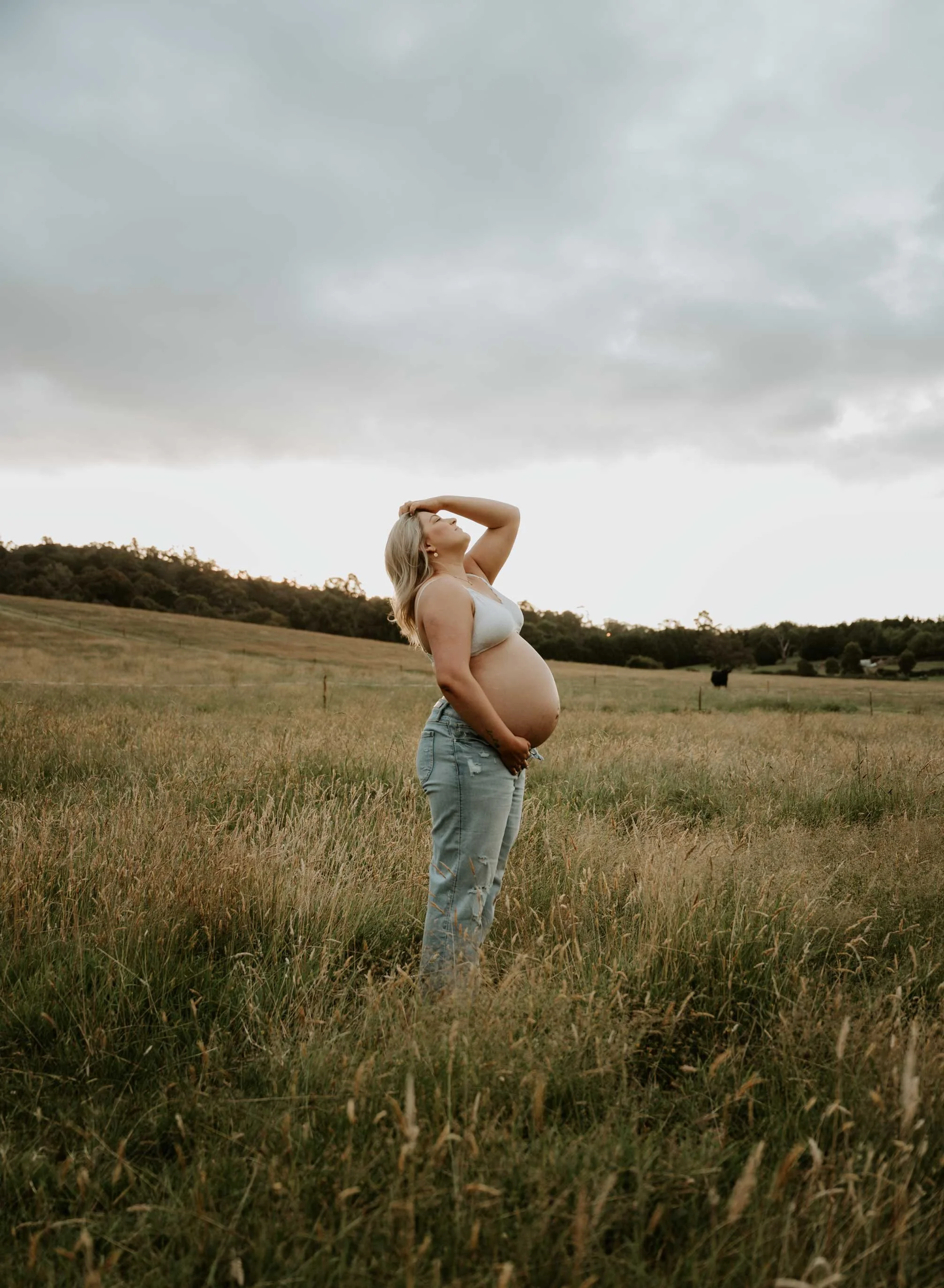 pregnant goddess in sunset in a field