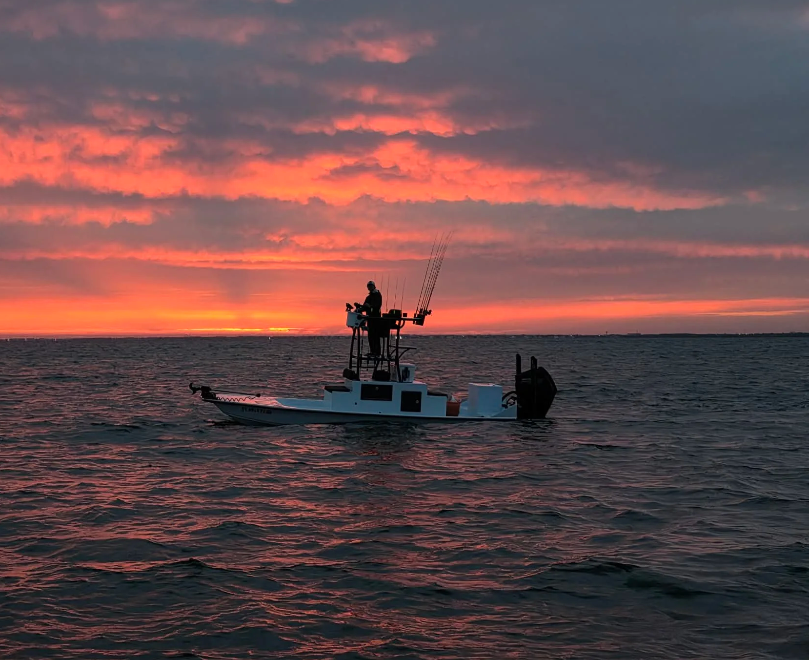JC Fishin sunrise on boat