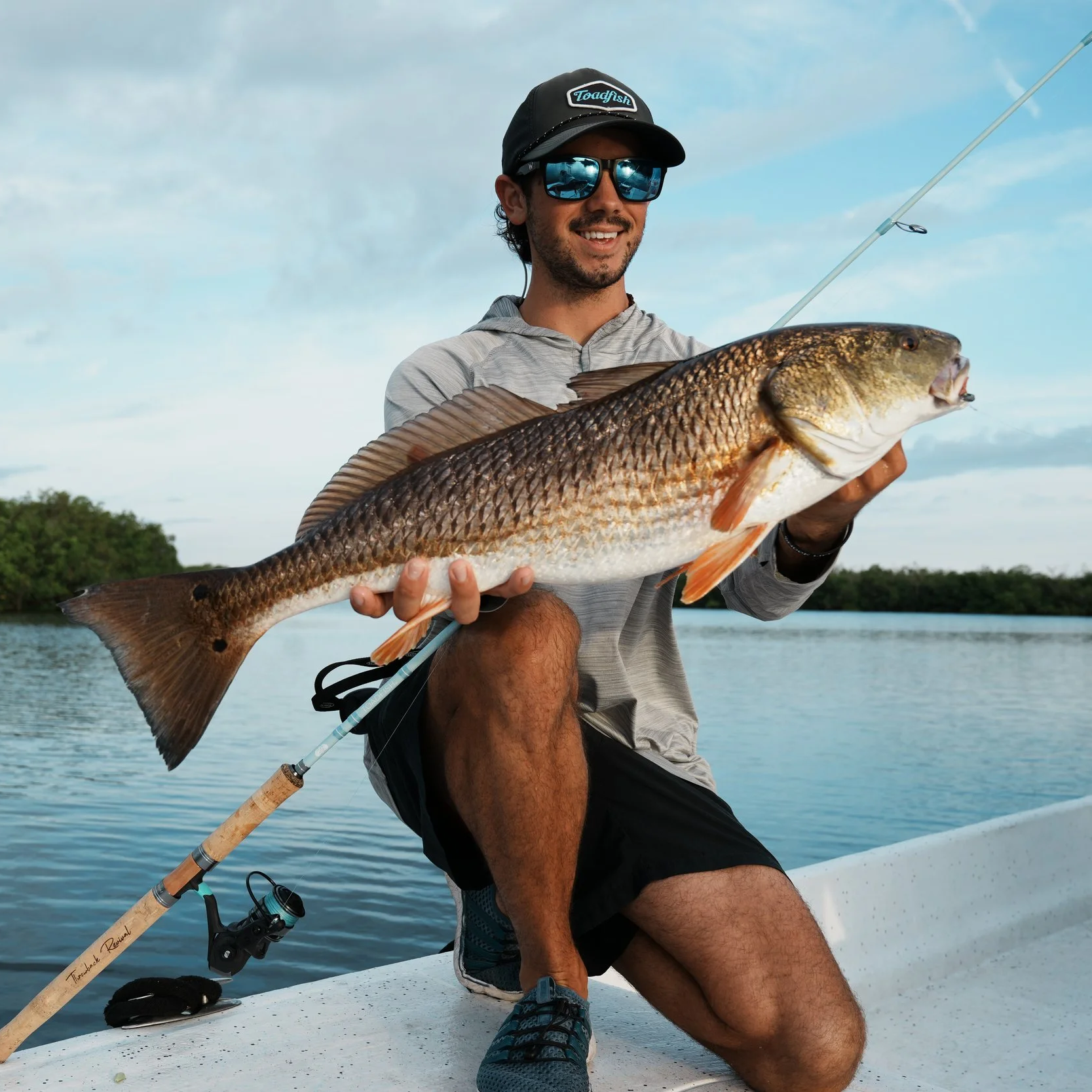 Captain JC holding a large Redfish