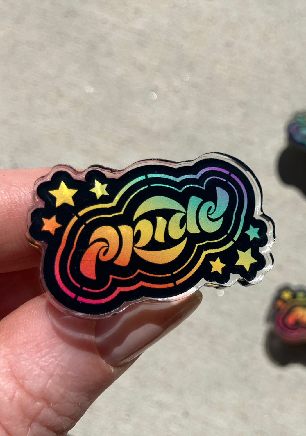 tania-hearn-ambigram-Pride pin front.png