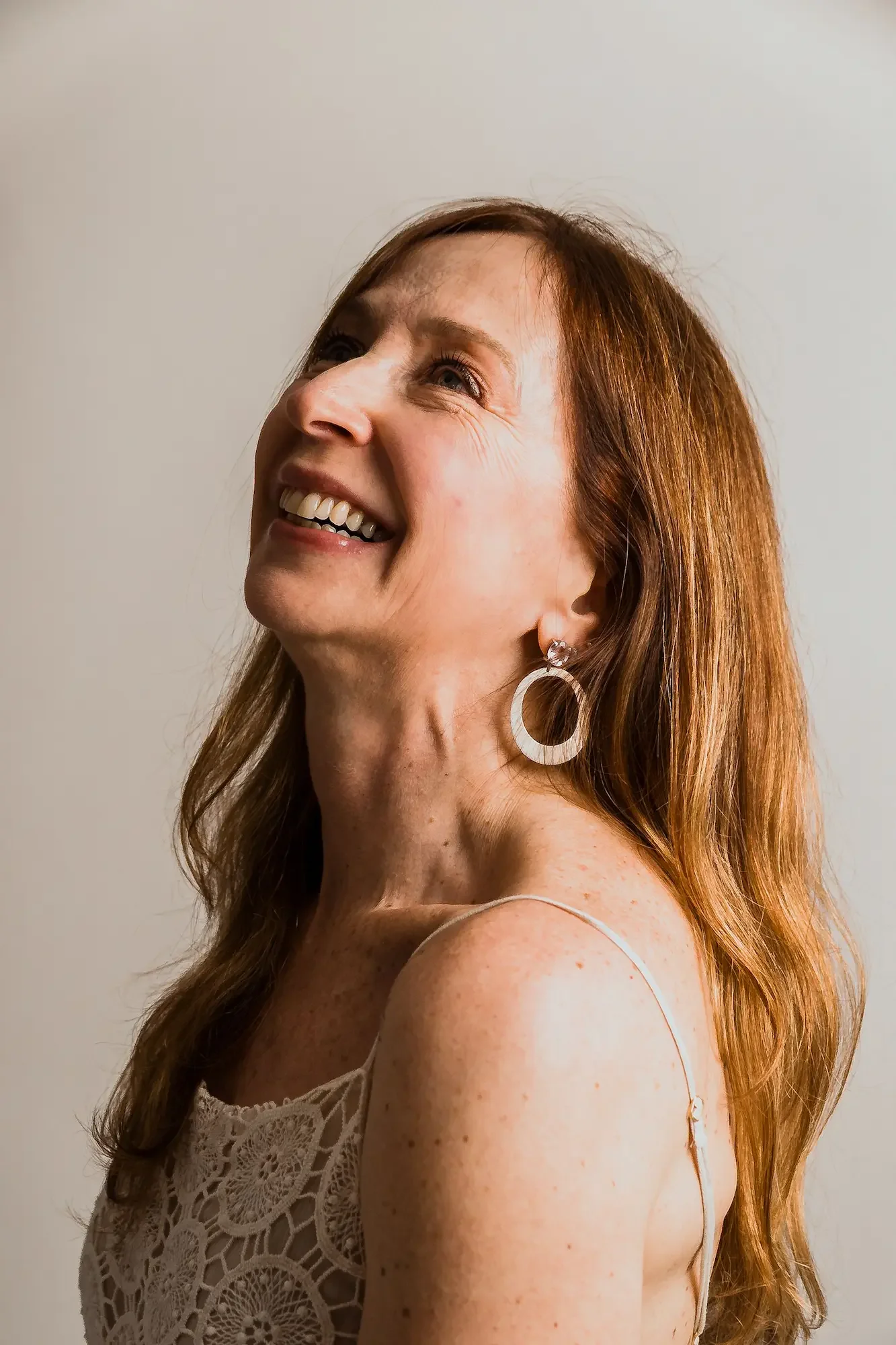 Smiling mature woman representing a menopause nutrition client testimonial