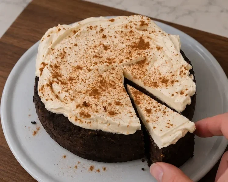 Chocolate tahini sweet potato cake freshly cut into slices with the moist chocolate centre visible.