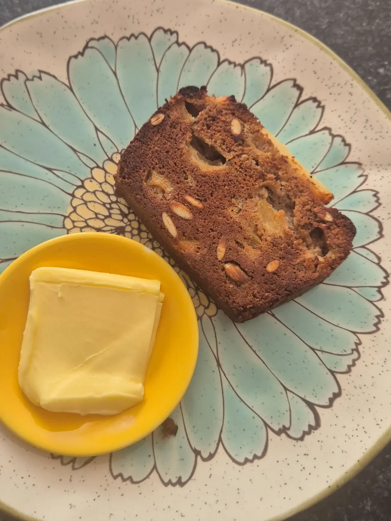 Toasted slice of pear and honey loaf with melted butter, warm autumn breakfast idea, gluten-free and refined sugar-free