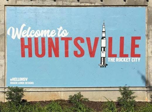 Welcome to Huntsville sign with rocket on it.
