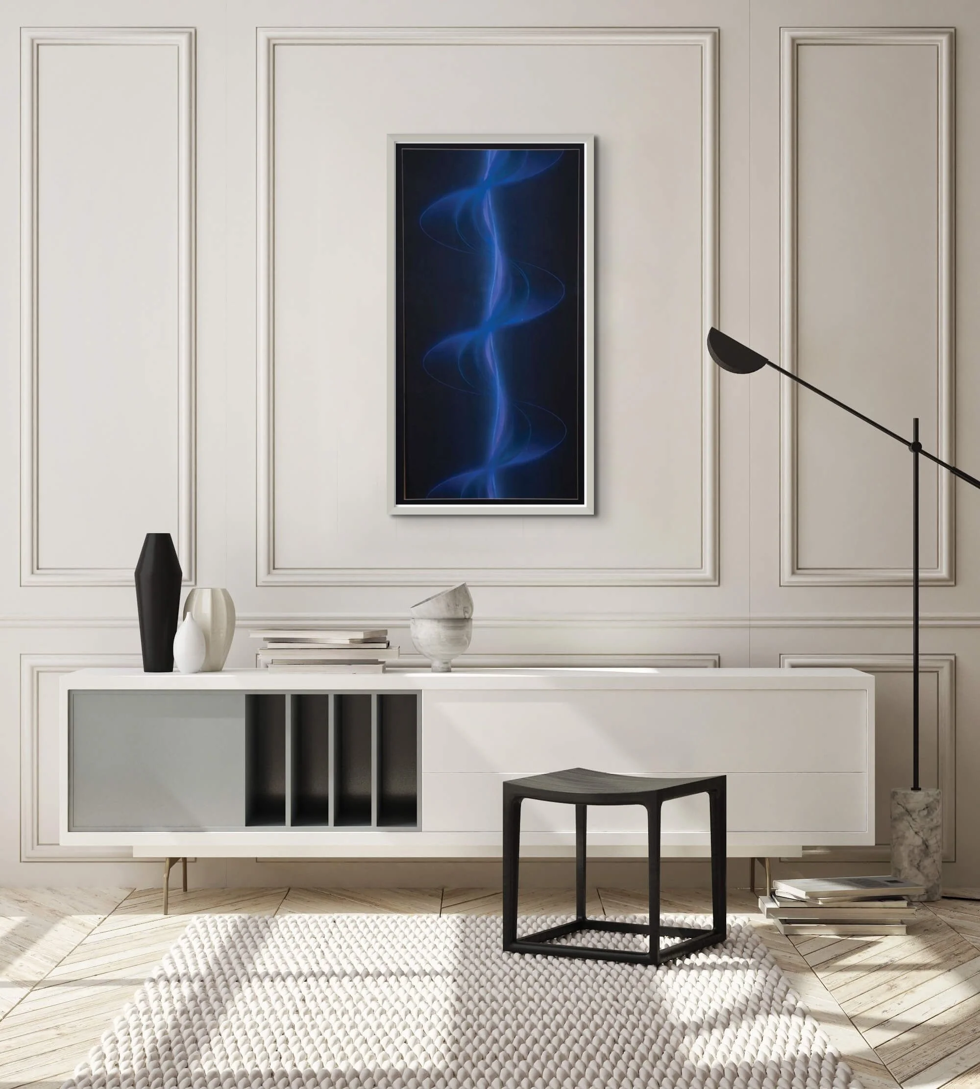A glowing blue spiral twists vertically against a dark background. The spiral’s curves are soft and luminous exhibited on a white wall in living room hung up on a wall to demonstrate how the painting looks in an interior.