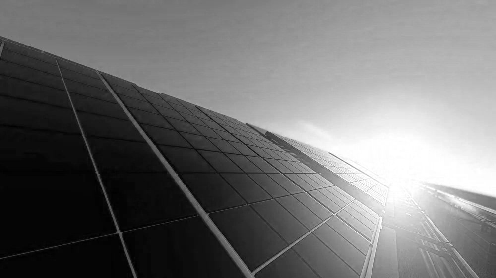 Close-up view of solar panels on a roof during sunset or sunrise