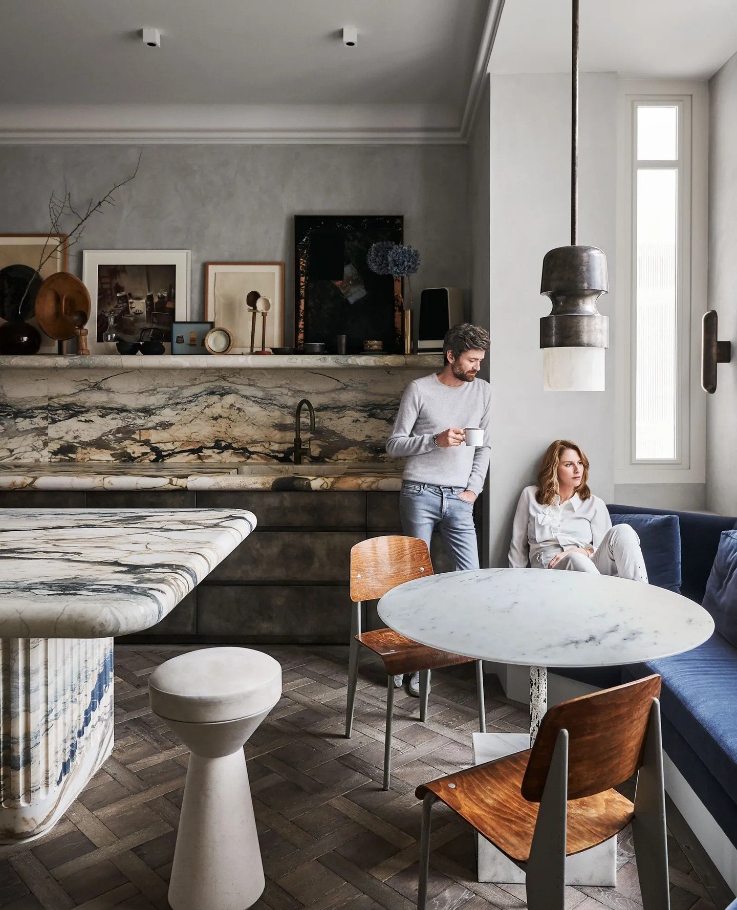 I love layered art in a kitchen. If it's up and out of the way, why not? Collections like this add so much personality and create a unique story. This kitchen belongs to one of my favourite designers, Joseph Dirand. ⁠
⁠
Photography by @adriendirand f