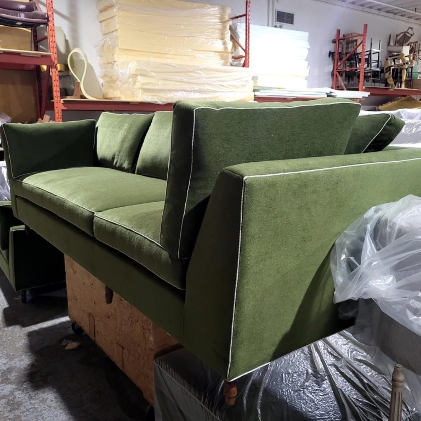 This is a sofa we designed, waiting at the upholstery shop, just about ready to be sent to our client's house. We love designing original custom pieces for our clients, and having them made by talented local artisans. ⁠