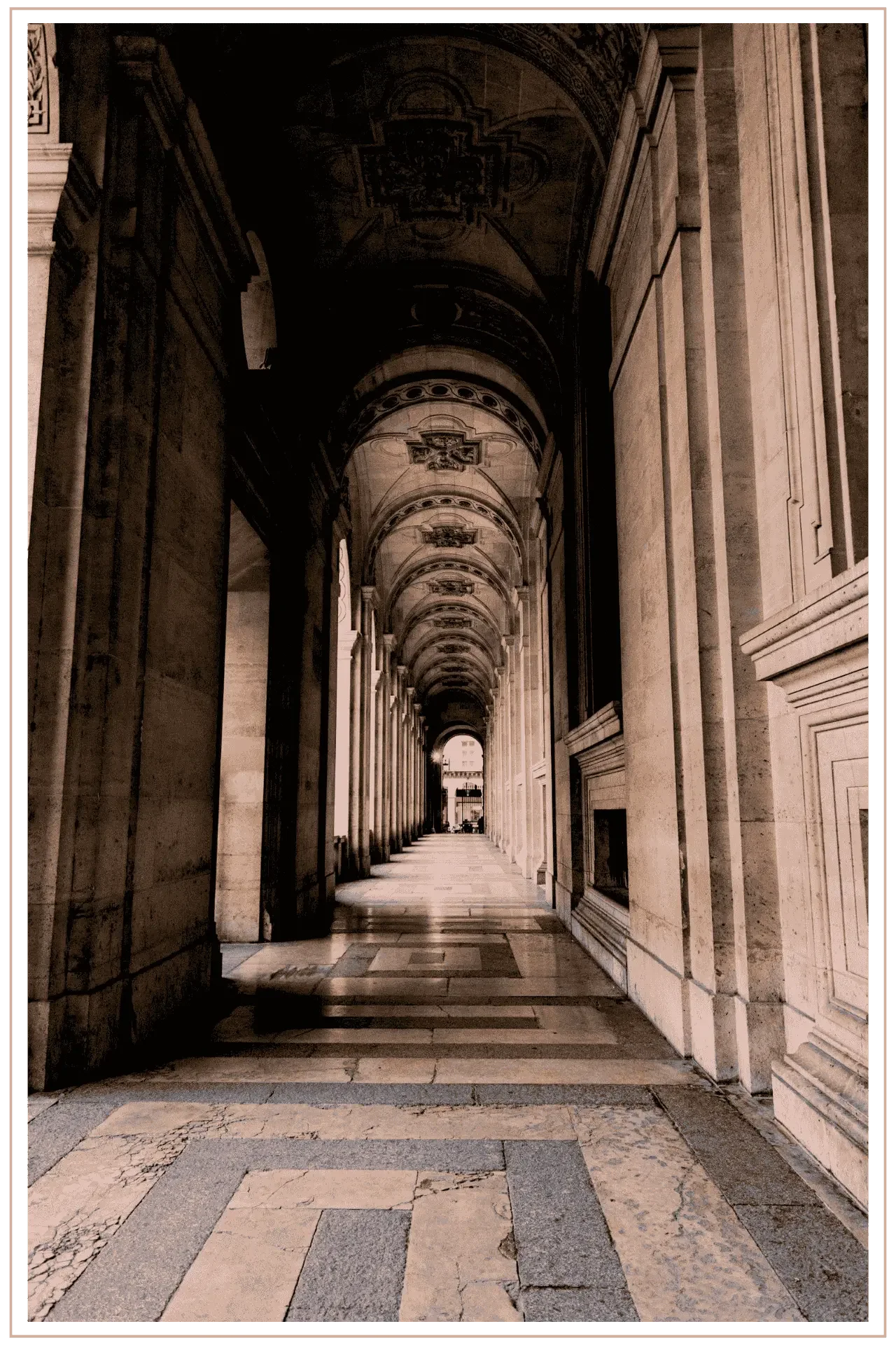 A serene, sun-drenched perspective of classical stone archways and columns in Paris, capturing a quiet moment of morning light and architectural heritage.