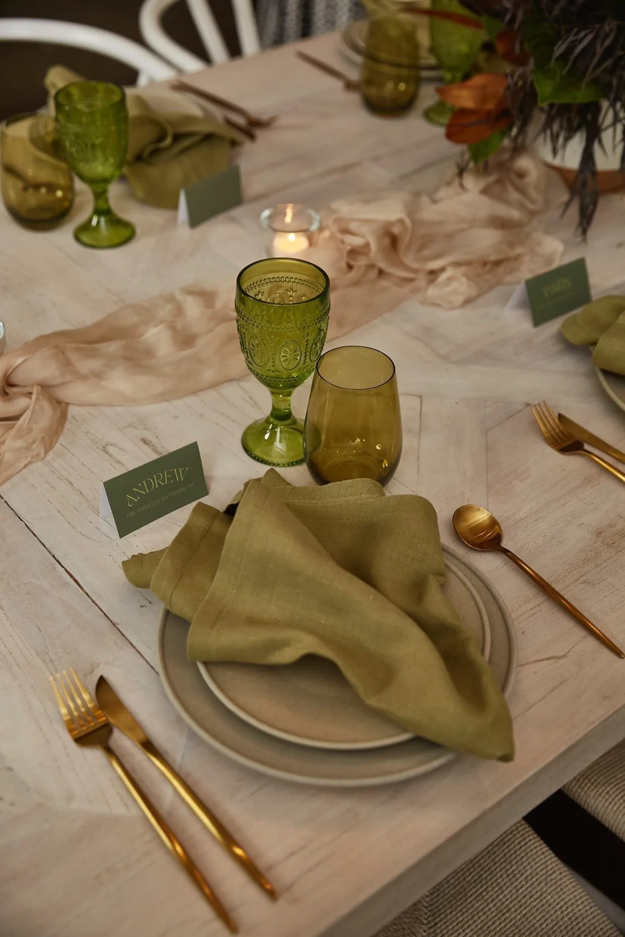 olive green theme table setting with brushed gold cutlery