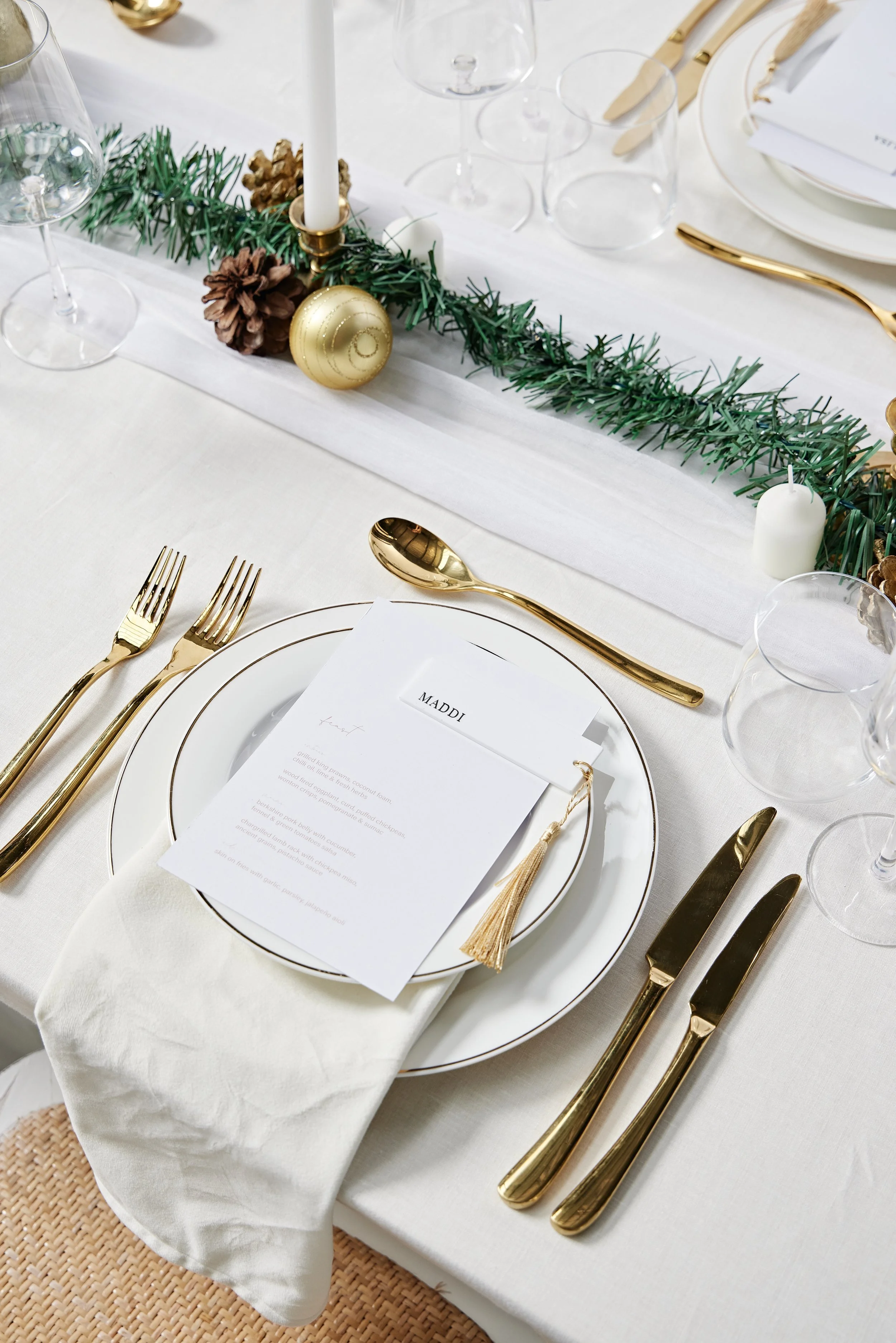 christmas table setting with gold cutlery