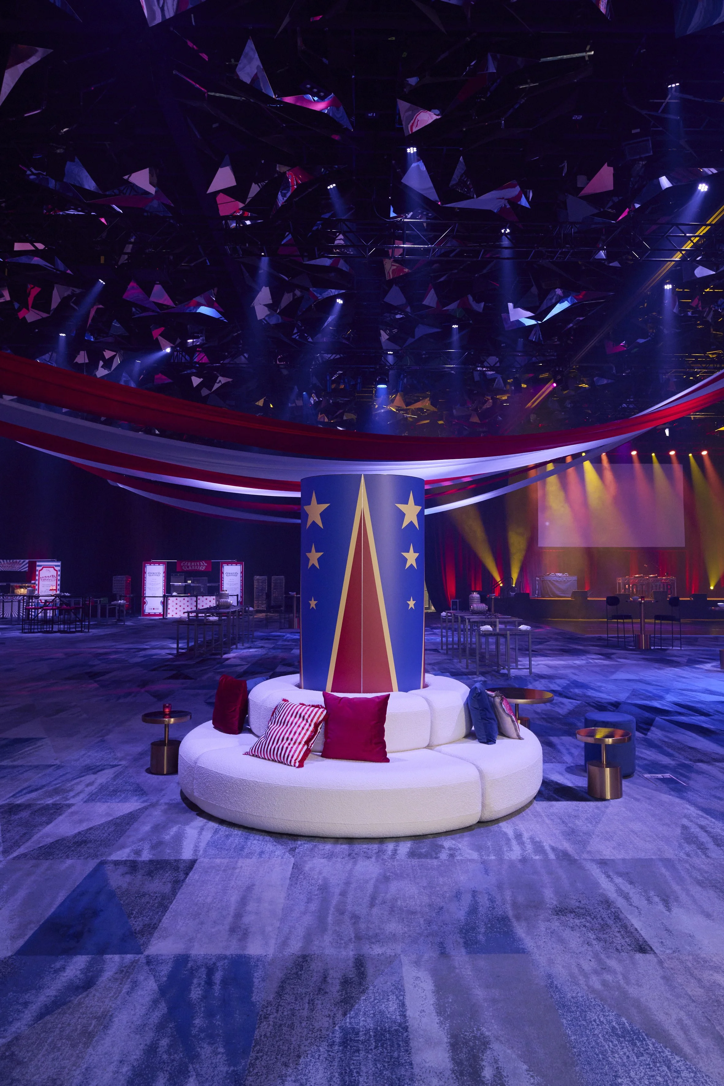 A sophisticated white modular sofa composed of four curved sections that seamlessly form a full circular silhouette, upholstered in sumptuous bouclé fabric.