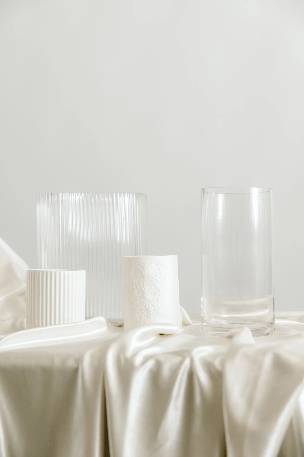 mixed white and clear vases