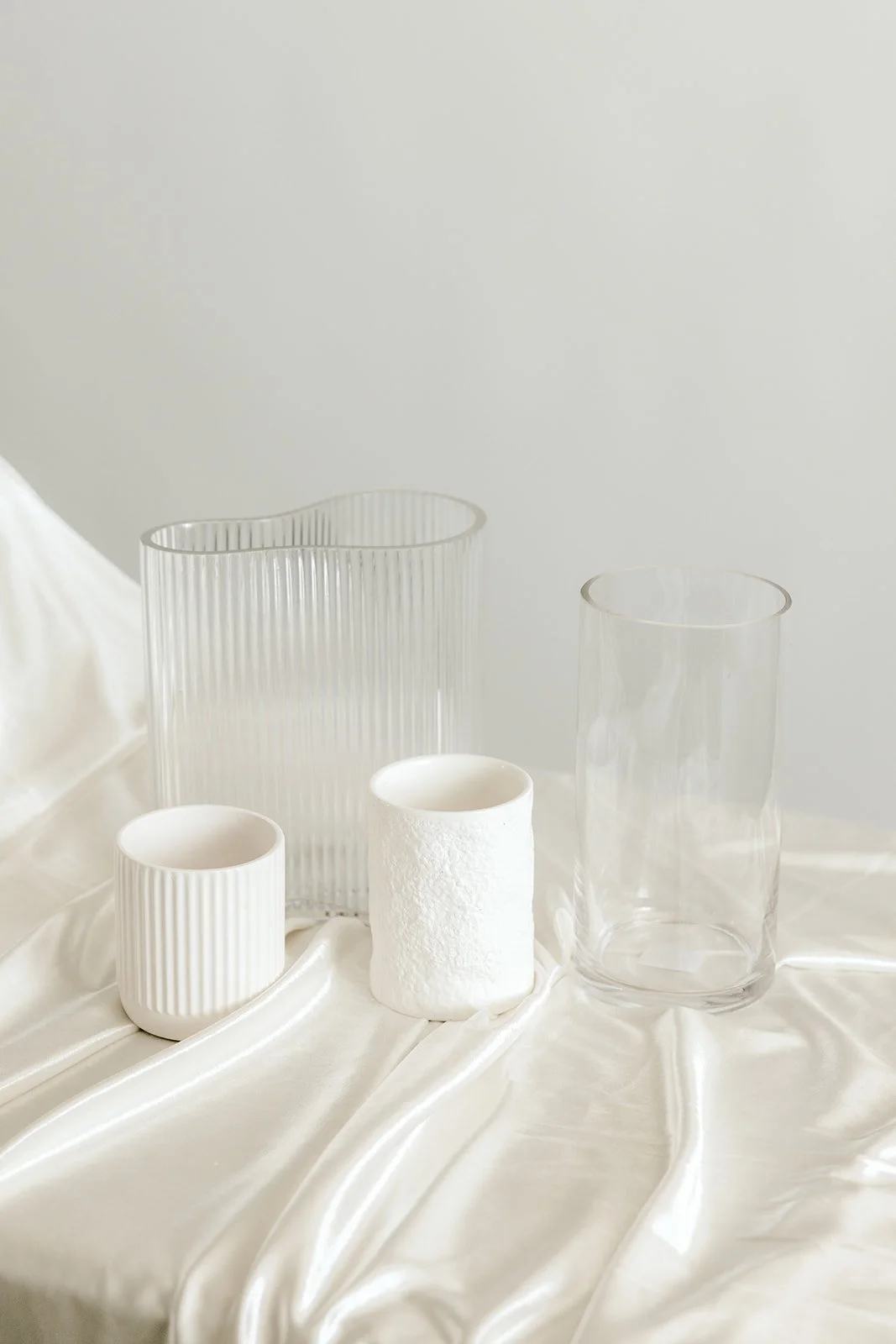 mixed white and clear vases