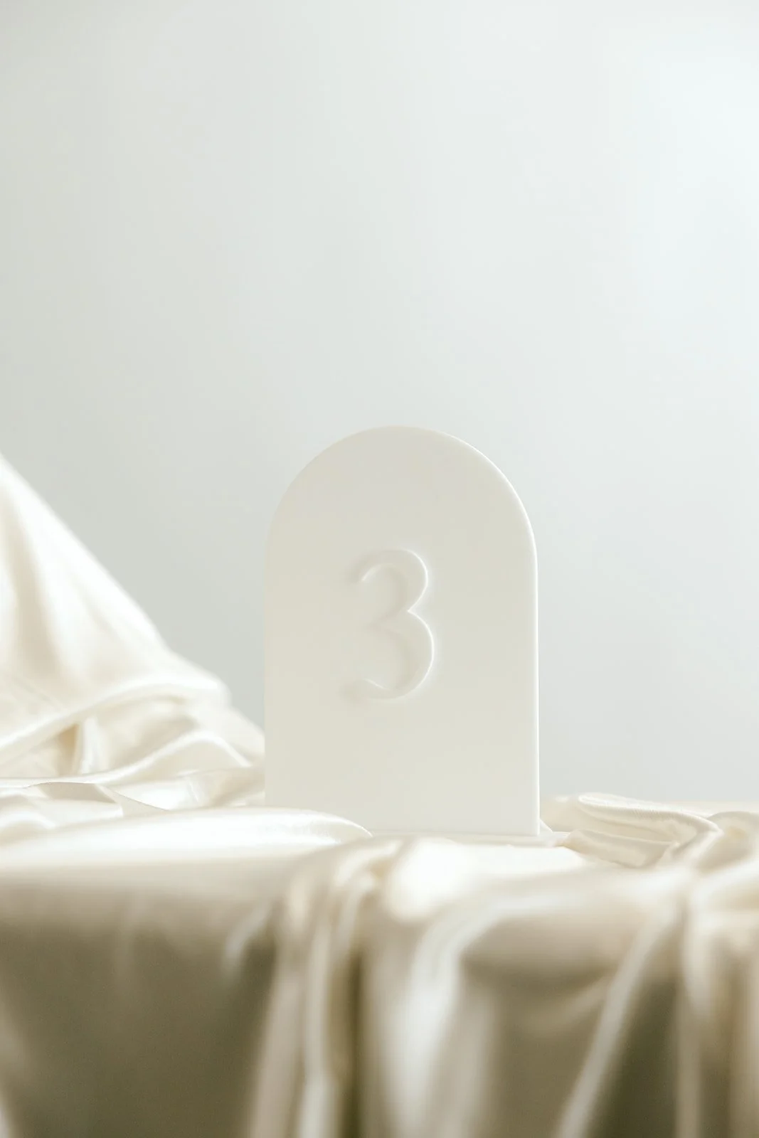 White arched table number