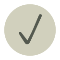 A green check mark inside a circular light sage-green background.