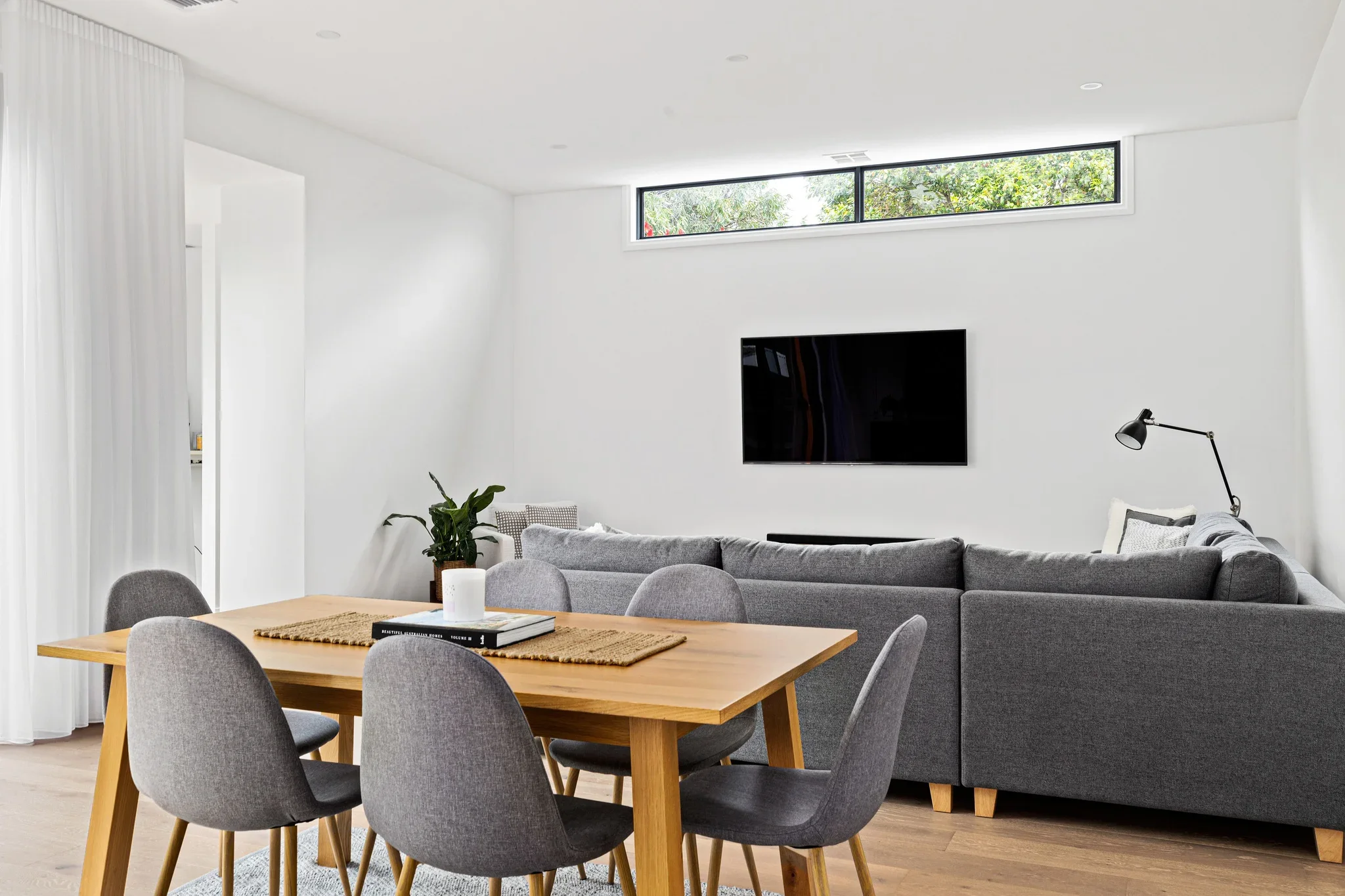 Modern residential dining and living in Watsonia by Dean McCredden Architect