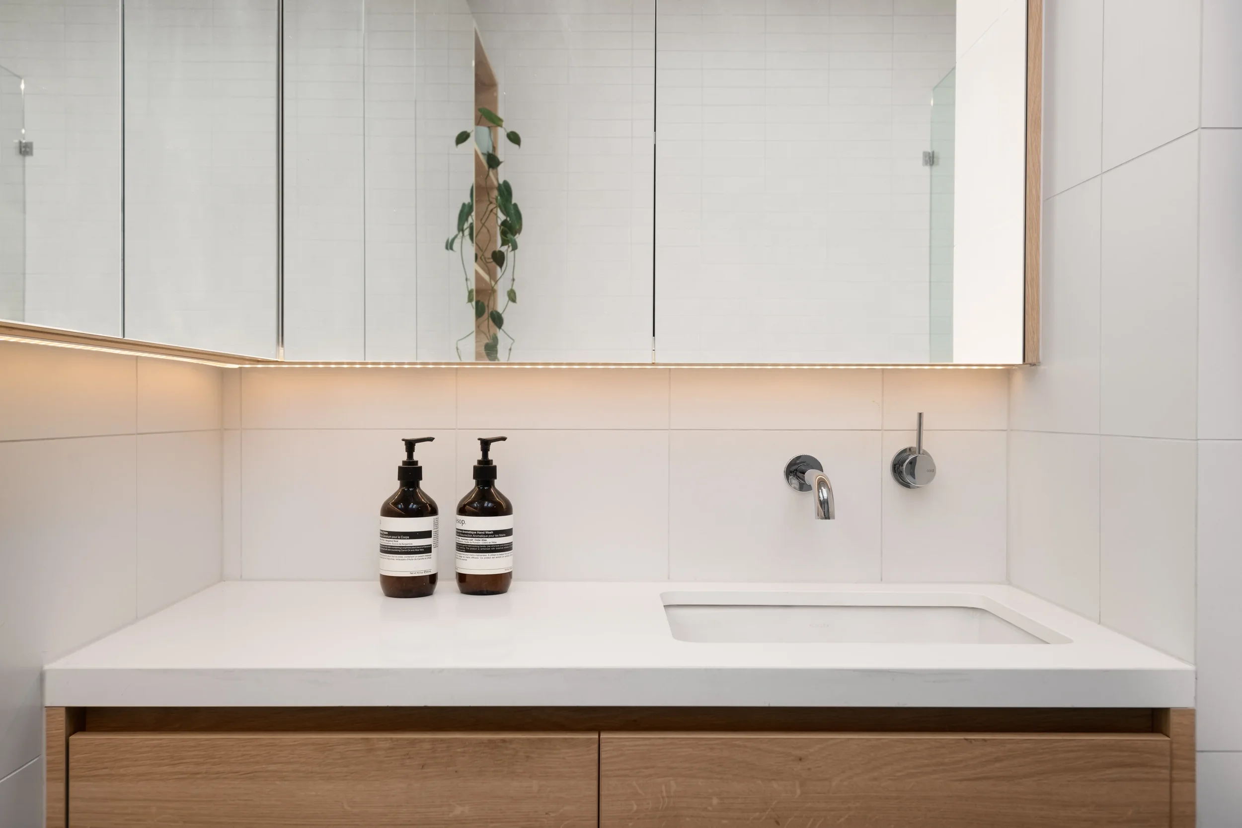 Modern residential bathroom in Fitzroy by Dean McCredden Architect.