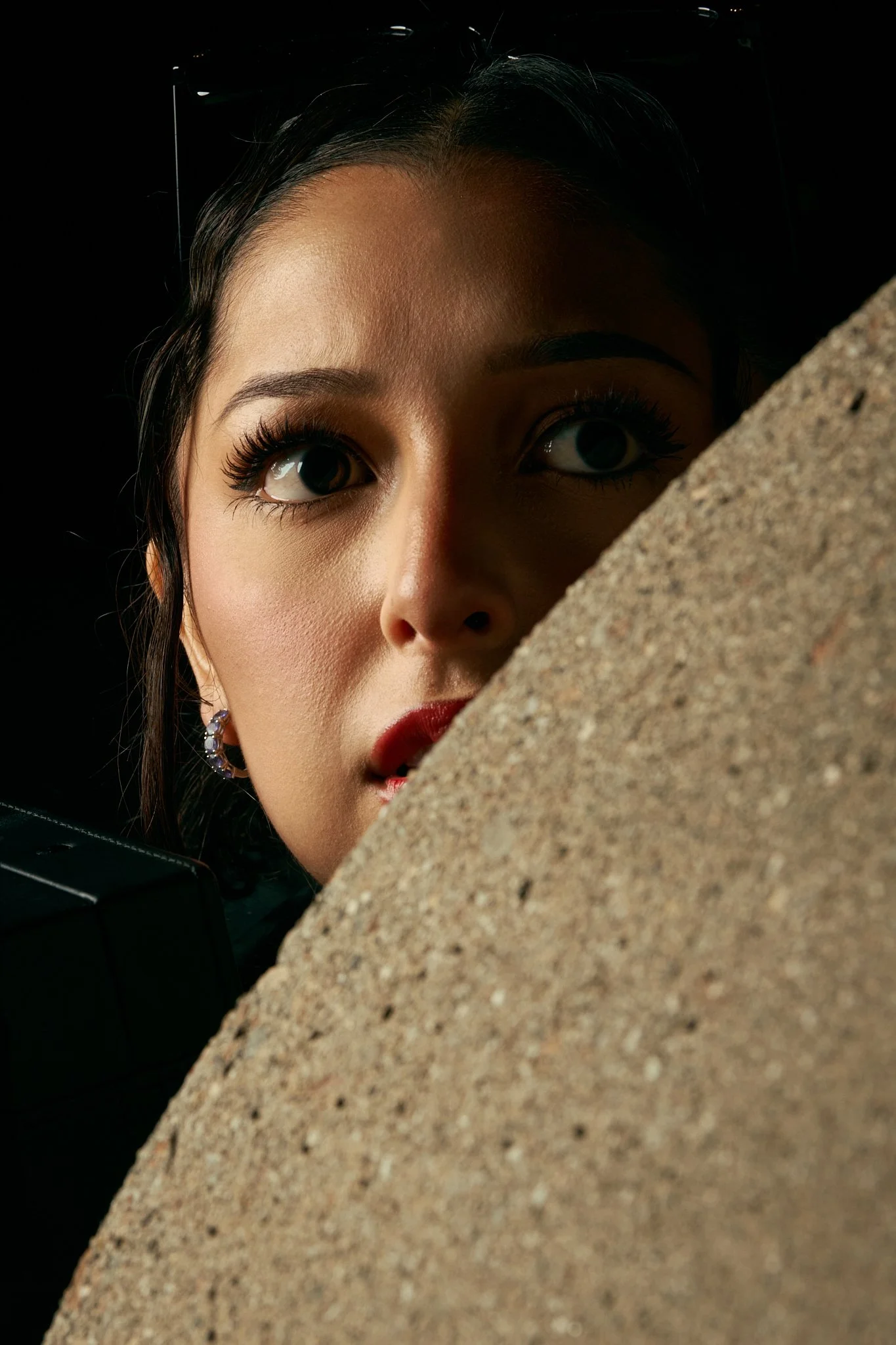 Night frame from The Getaway: a figure in a red dress lit against a dark Los Angeles street.