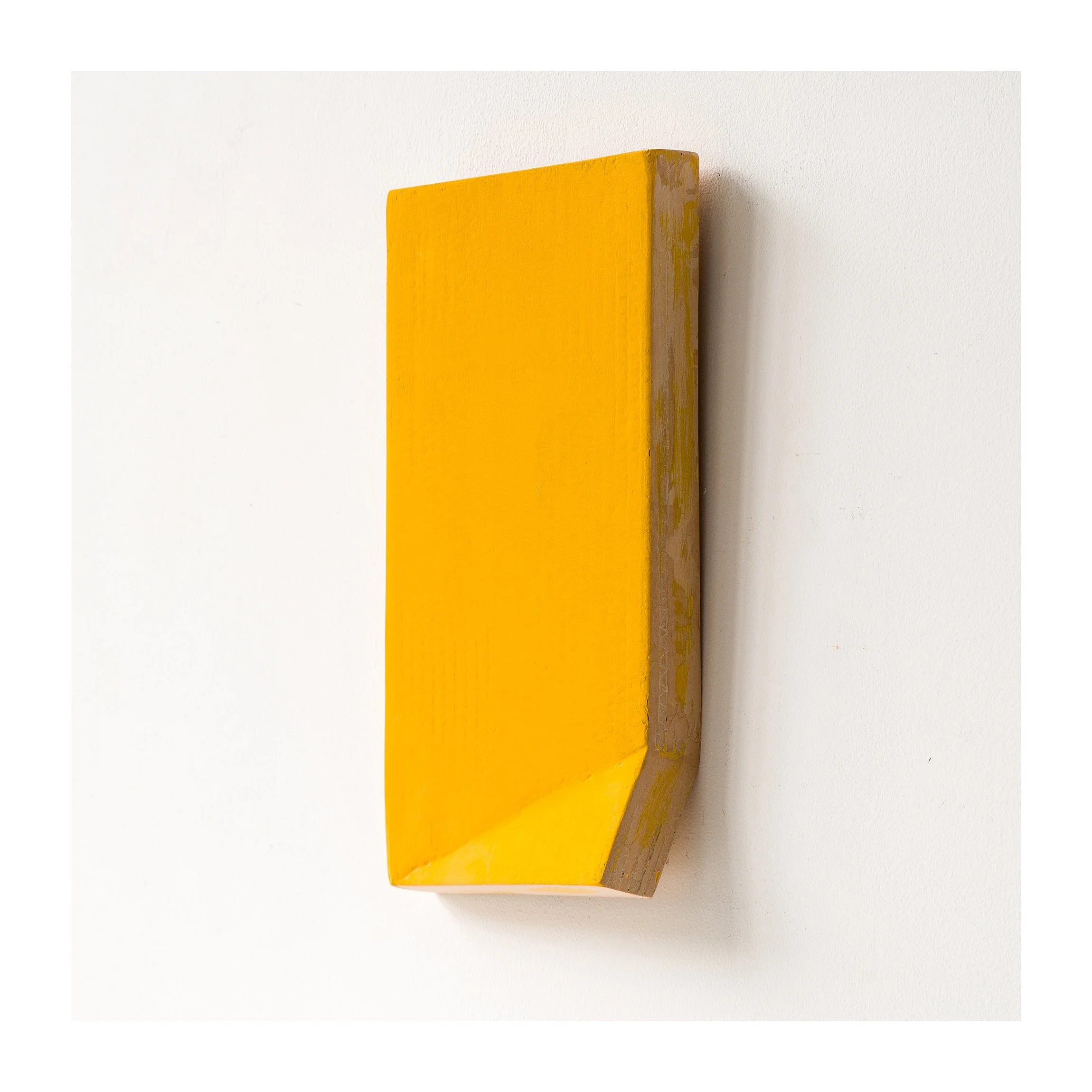 SOLD

Yellow rectangular wooden block on wall, minimalist design