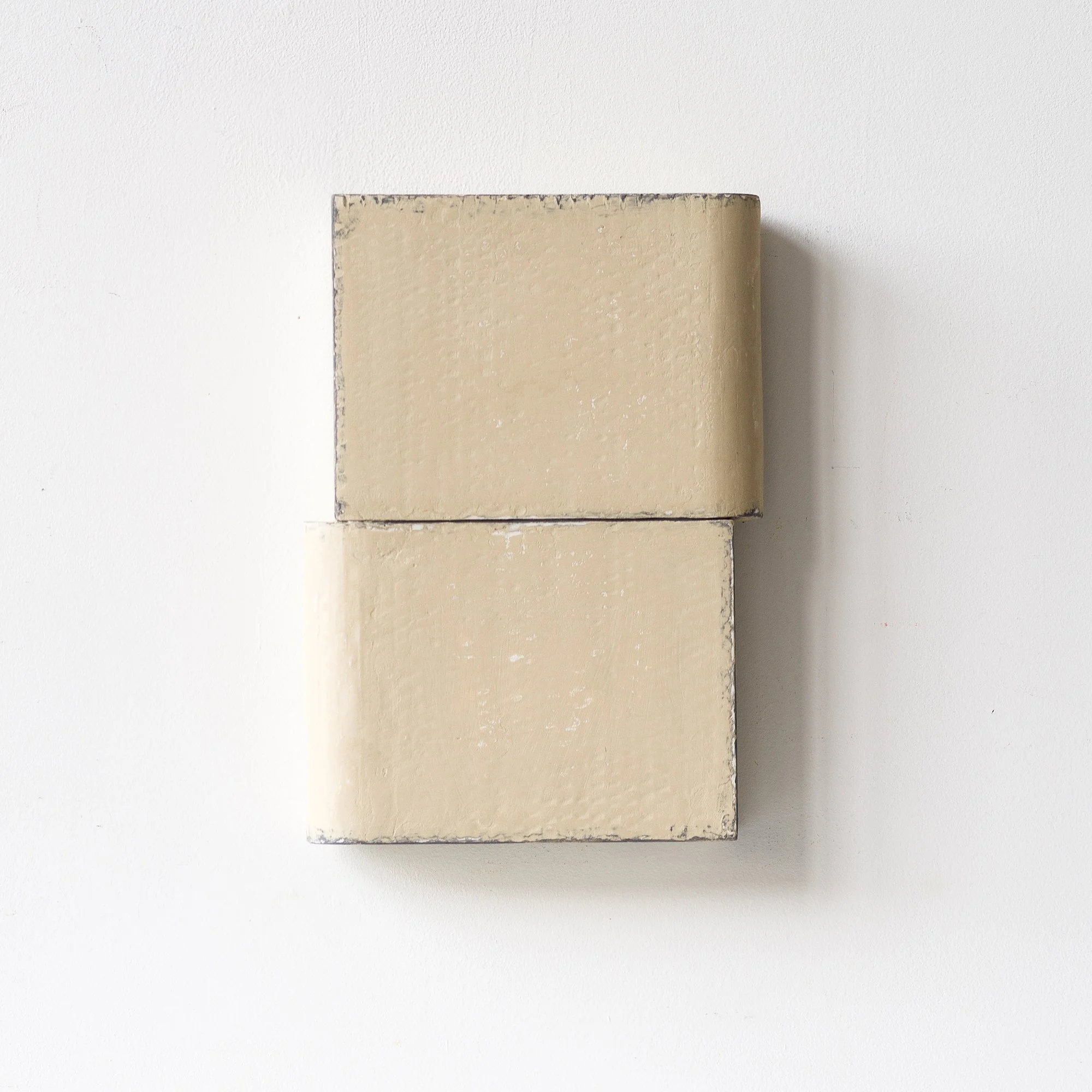 SOLD

Two stacked beige rectangular blocks against a white wall.