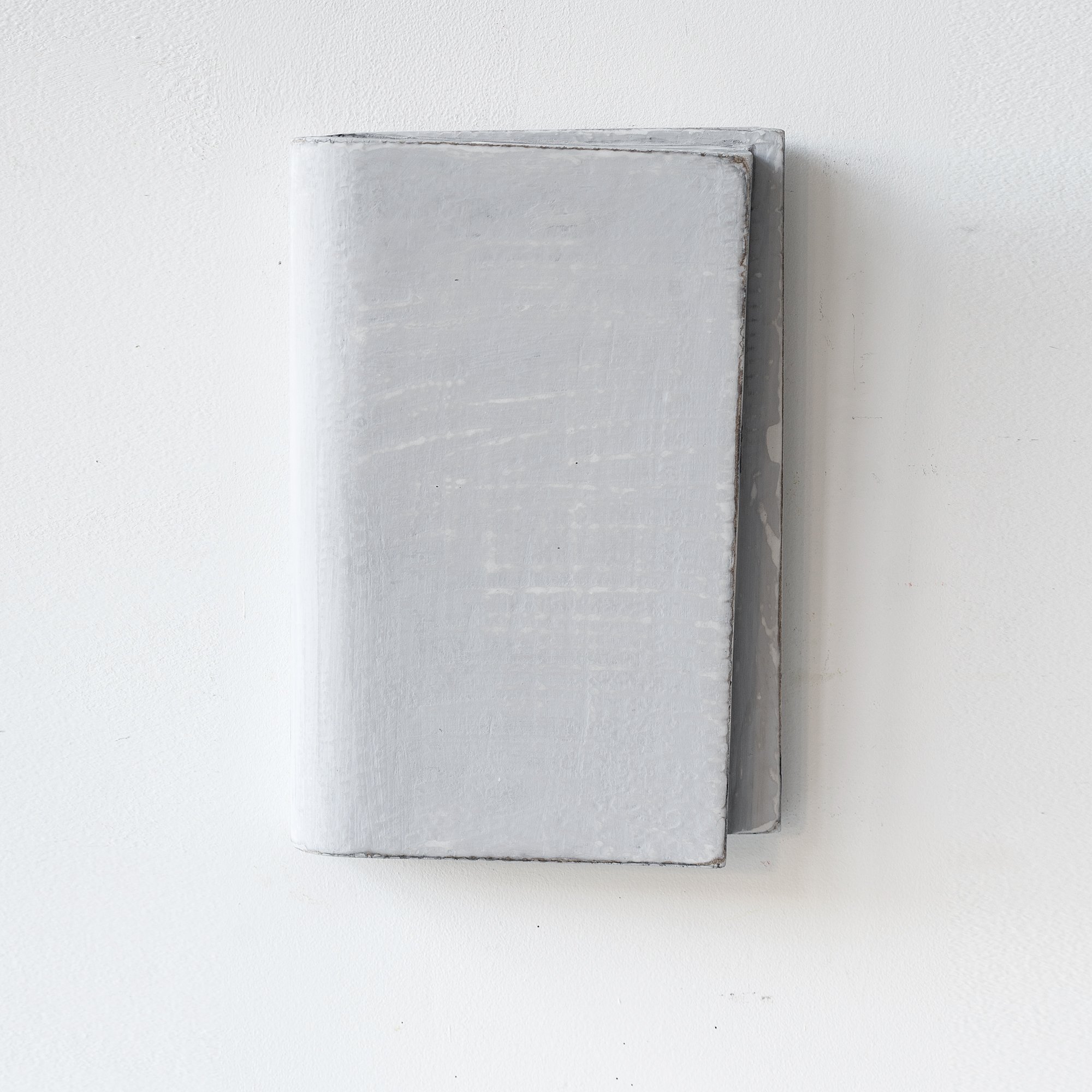 Grey 3D artwork a white wall