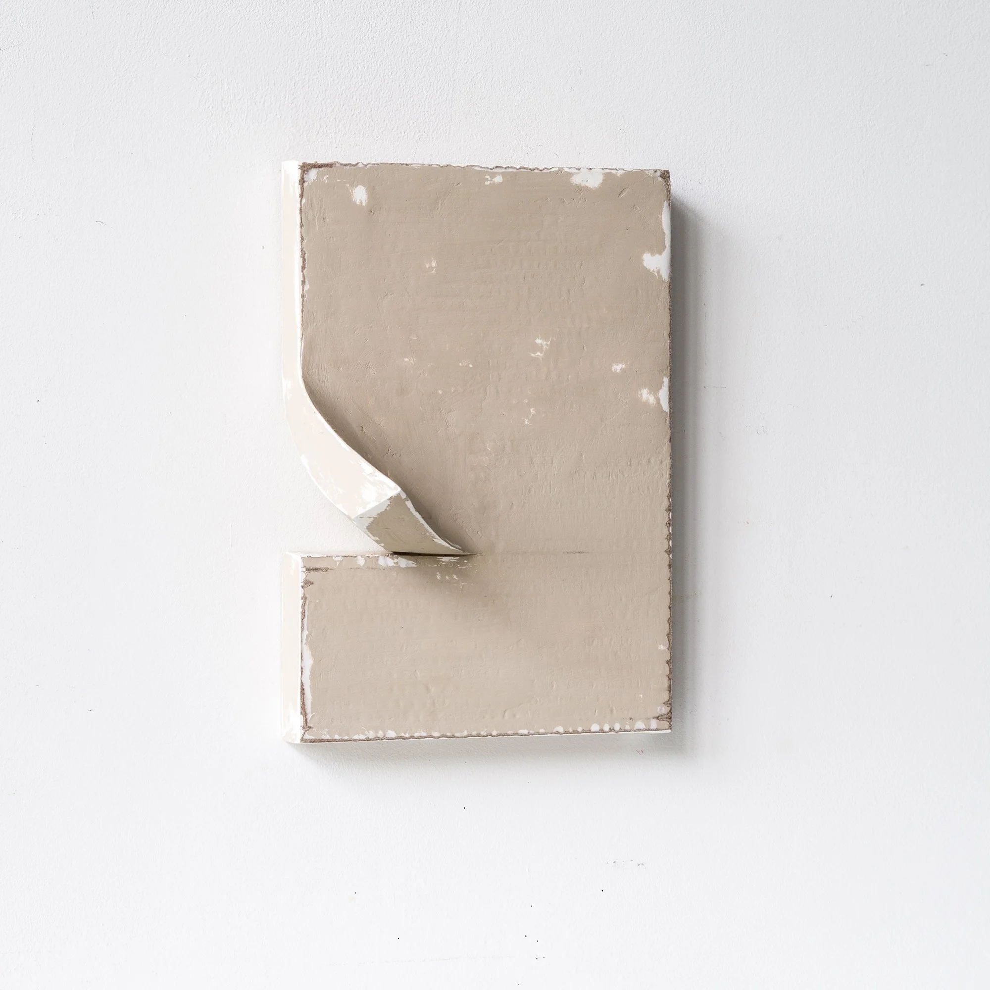 SOLD

Abstract beige textured artwork with a curled corner on a white wall