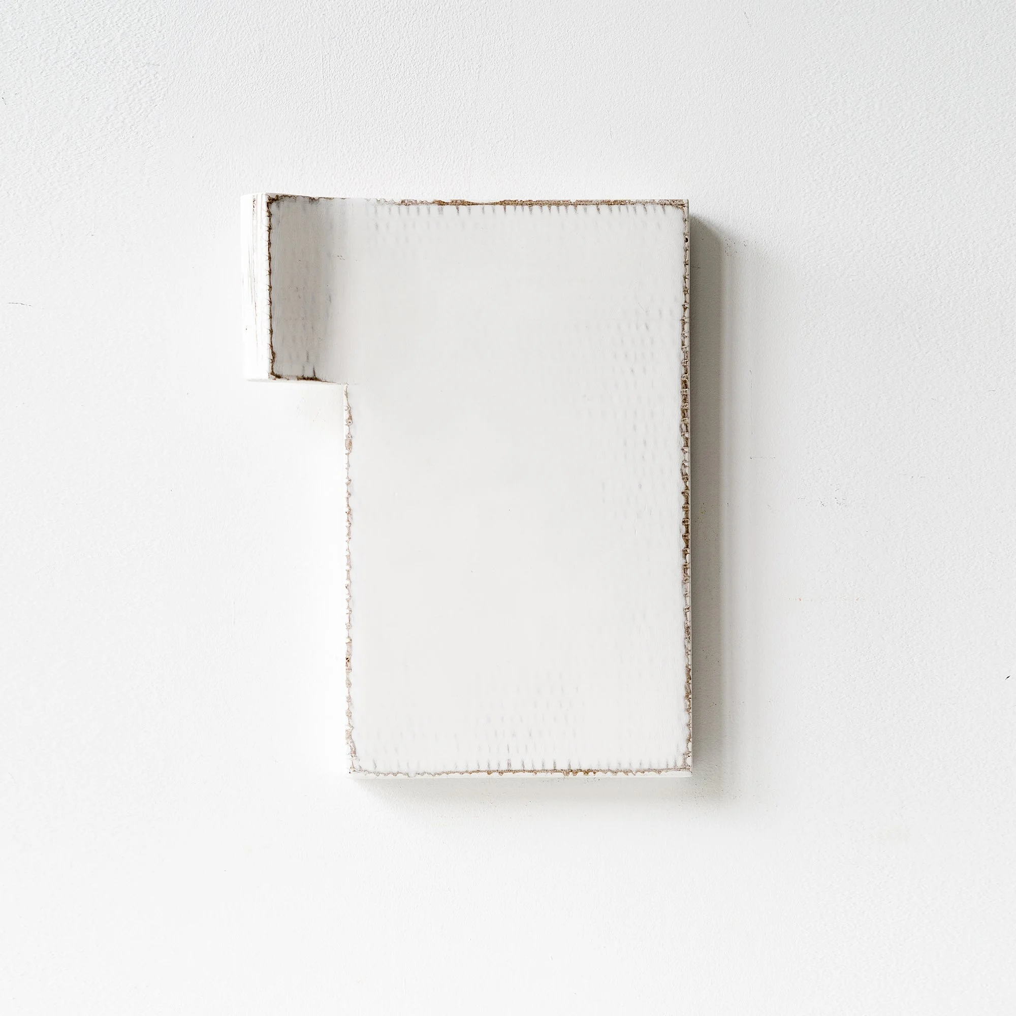 SOLD

Minimalist white rectangular artwork on a white wall with a protruding edge at the top left.