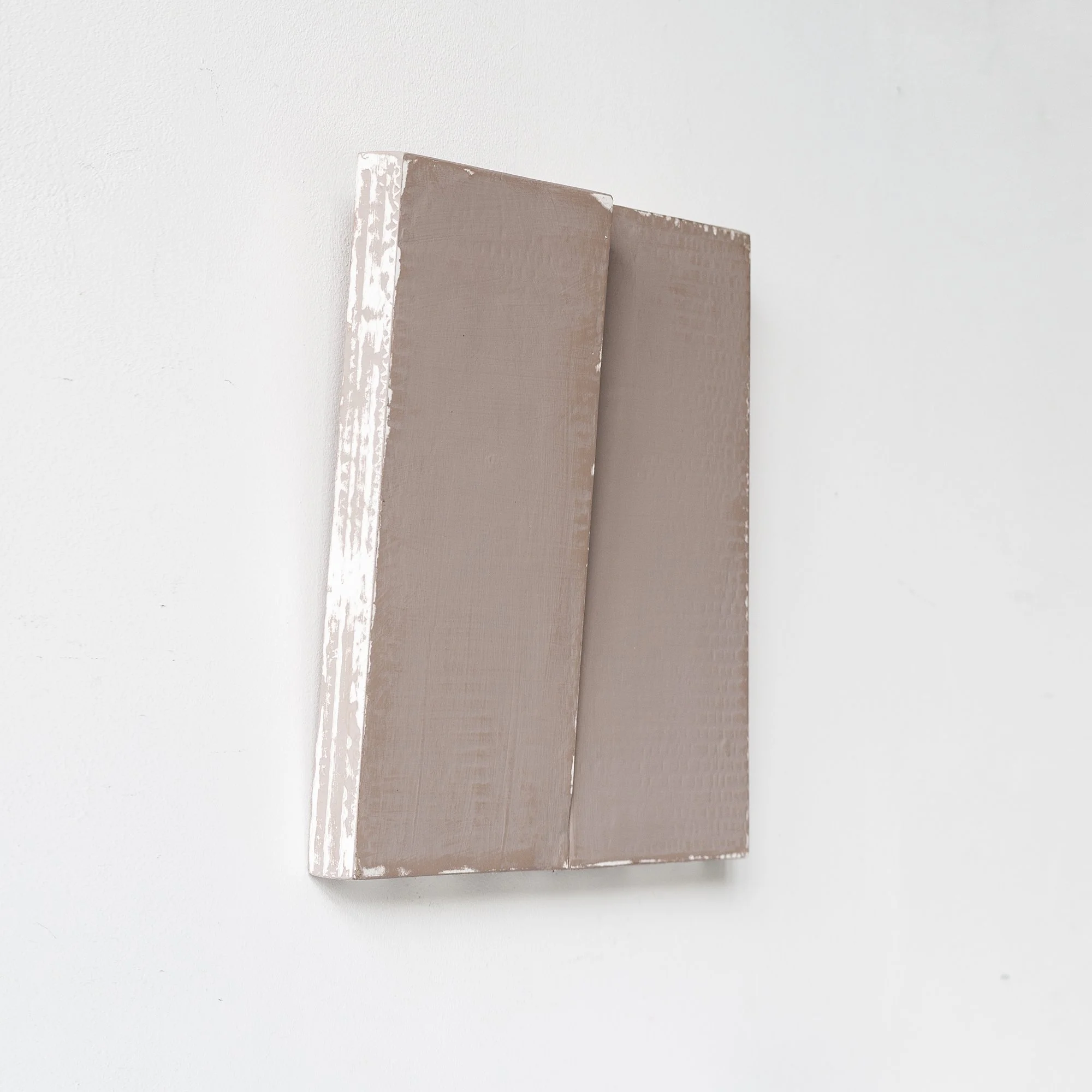 SOLD

Gray textured canvas on a white wall, minimalist artwork.